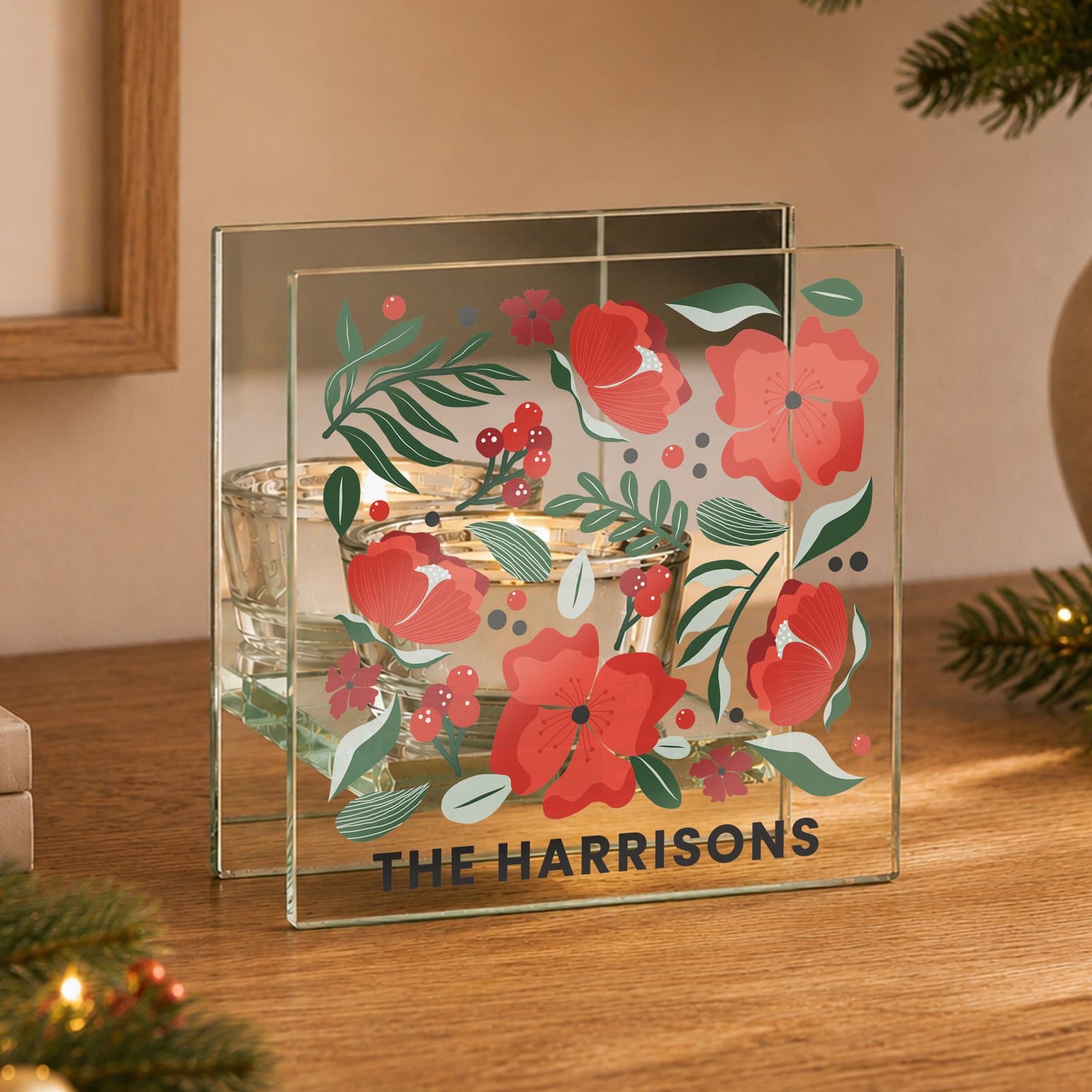 Mirrored glass tealight holder with a poinsettia design and personalised text