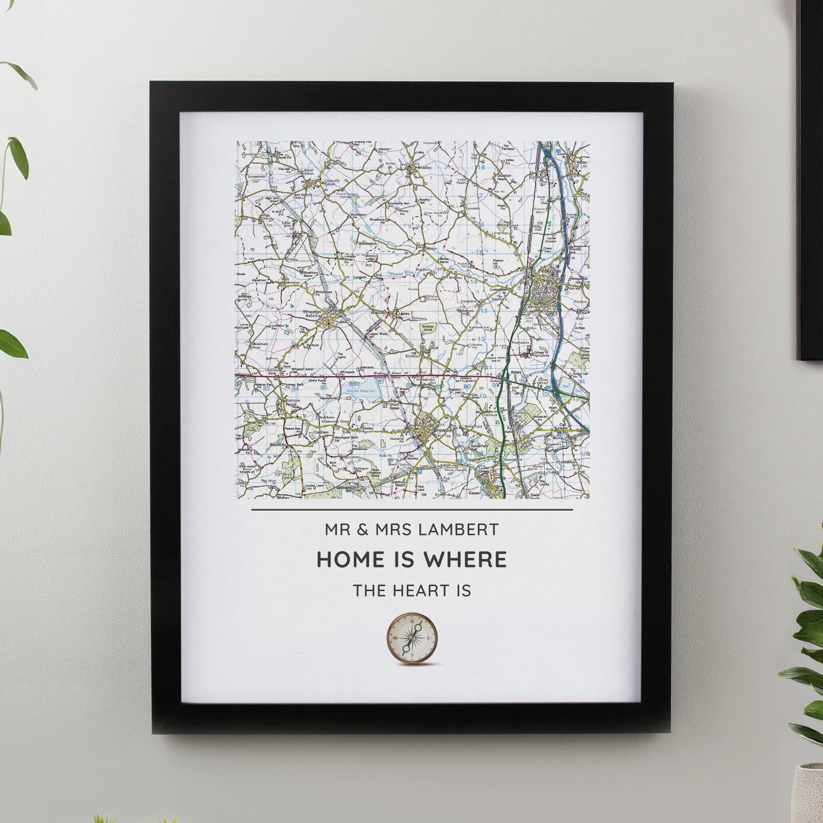 Black or white framed map print of a local area with a compass design and message