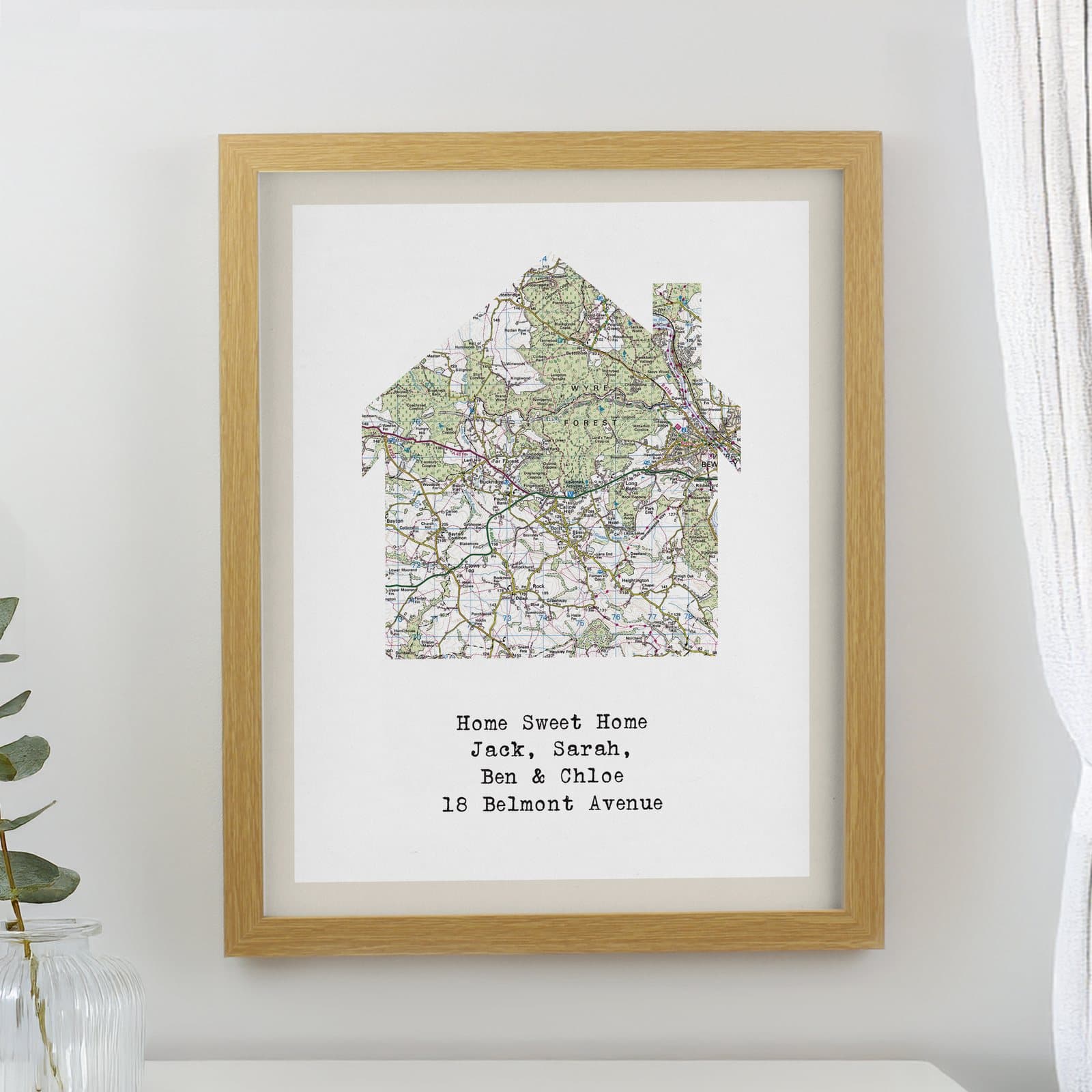 Present day map framed print in a large oak poster frame