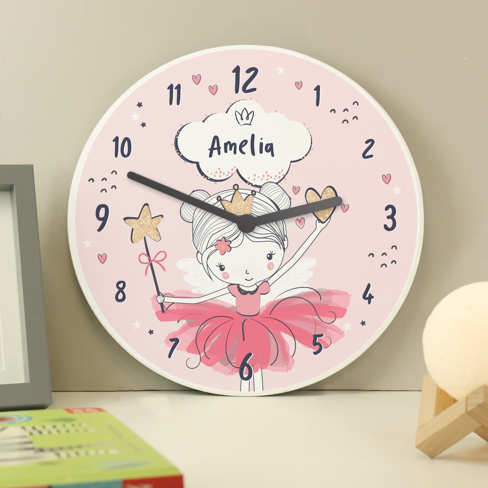 Wooden children's clock with a princess ballerina design in pastel colours