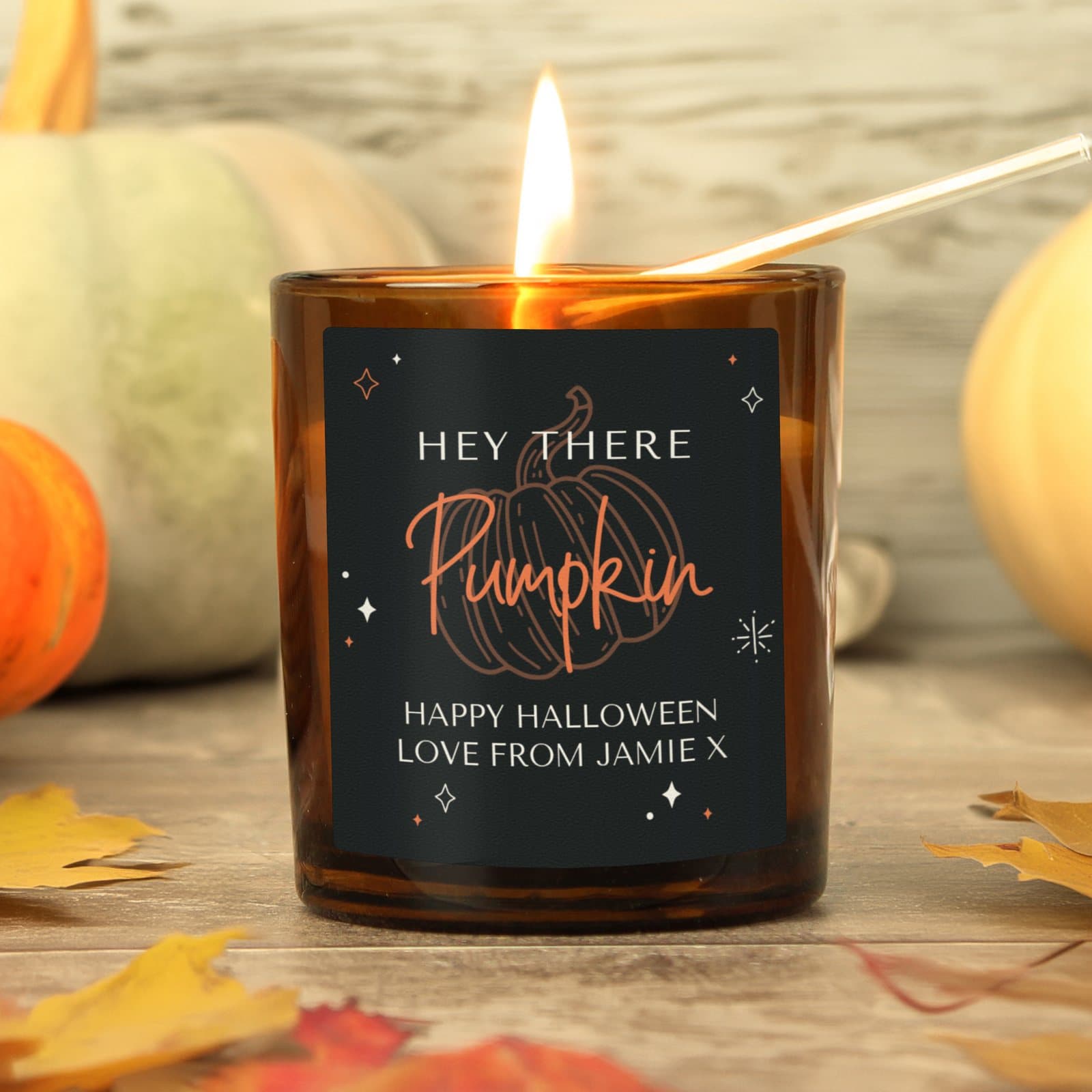 Amber glass candle jar with a personalised message label