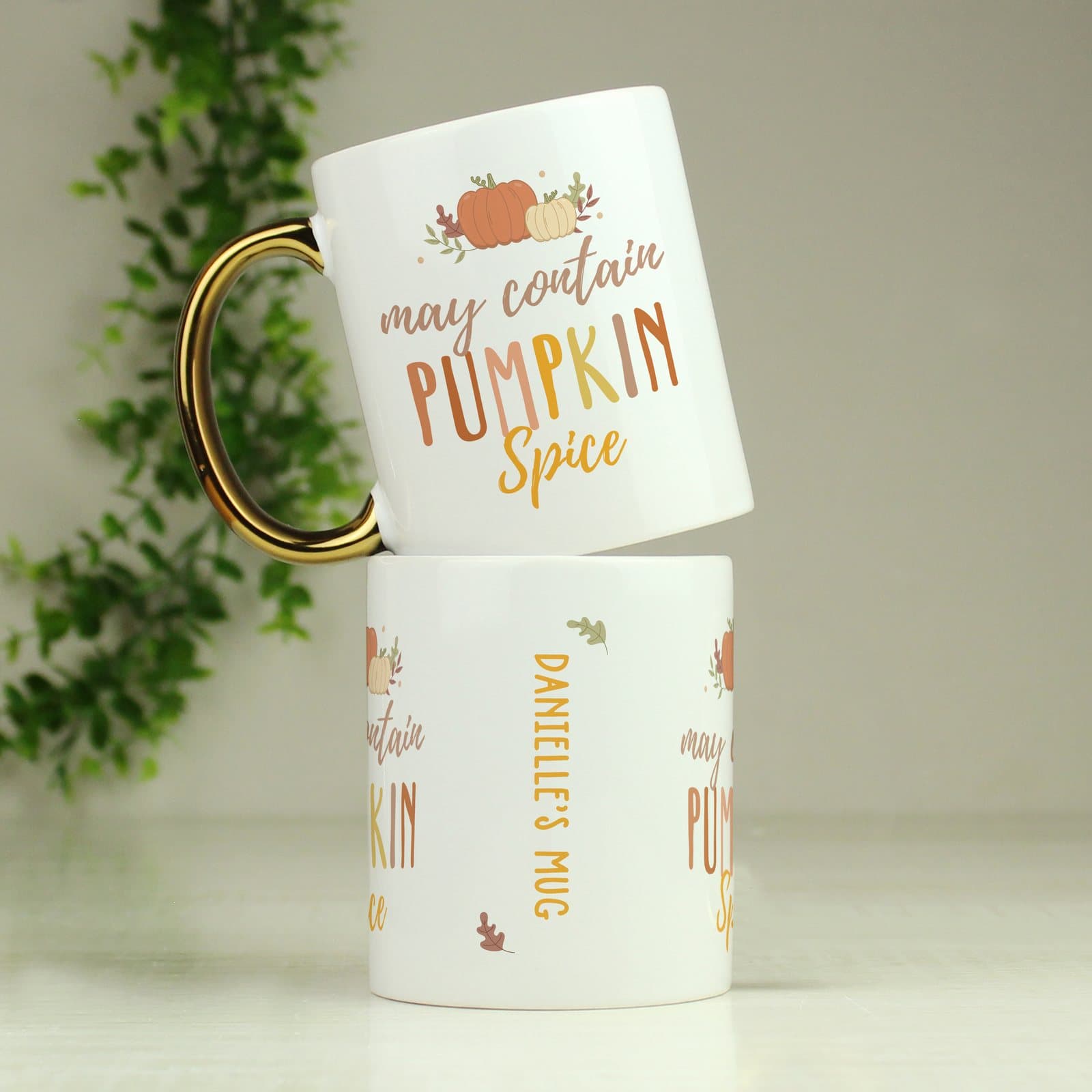 Ceramic pumpkin spice mug with a gold handle and personalised text