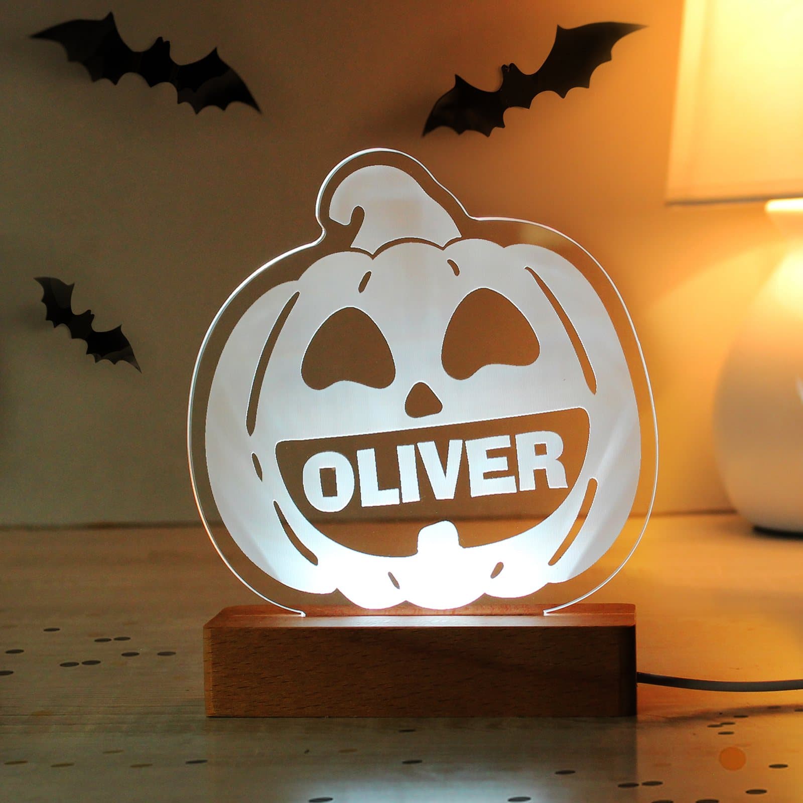 Wooden pumpkin LED light sign on a base