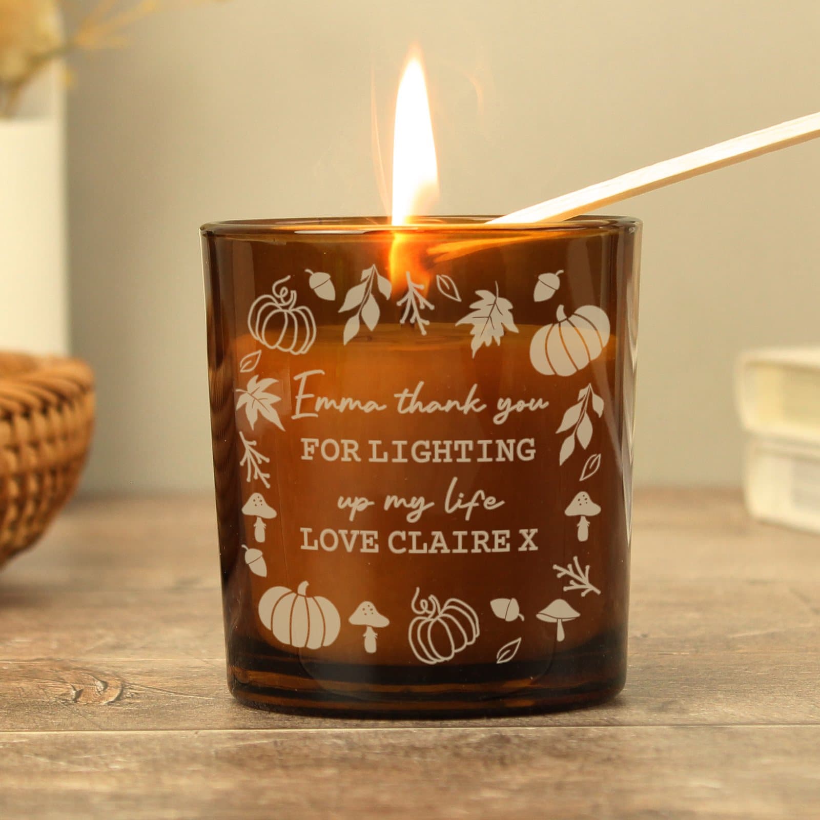 Amber glass candle jar with a pumpkins design and personalised text