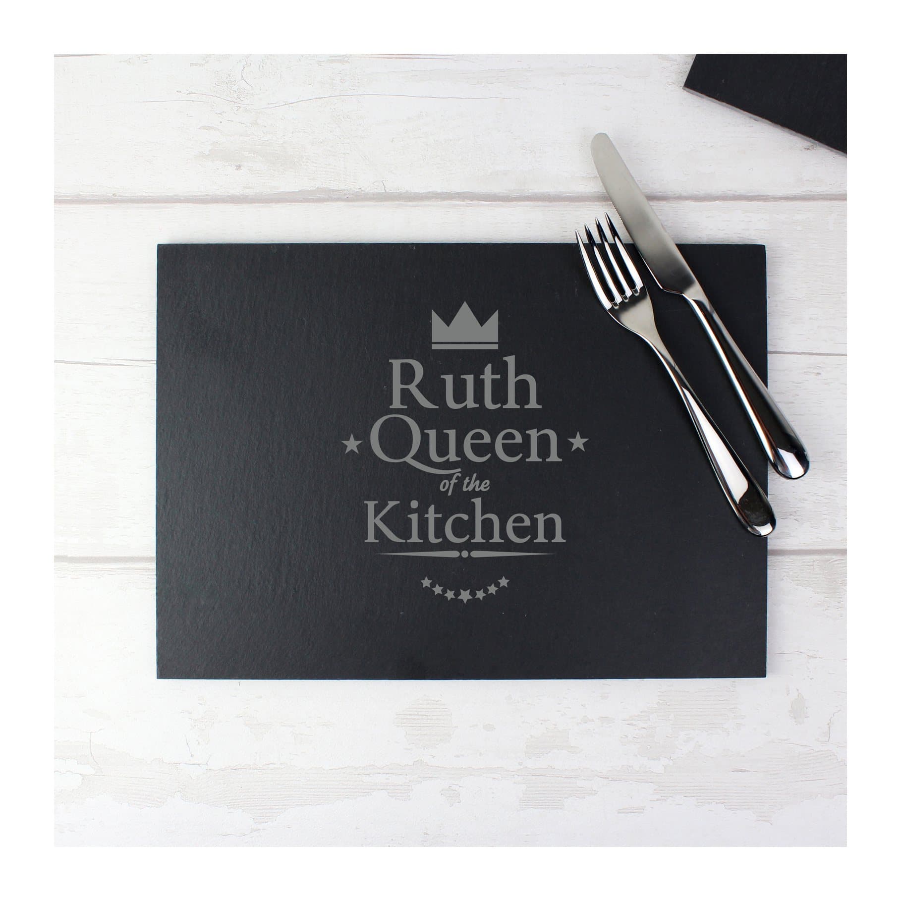 Rectangular slate placemat reading Queen of the Kitchen with a personalised name