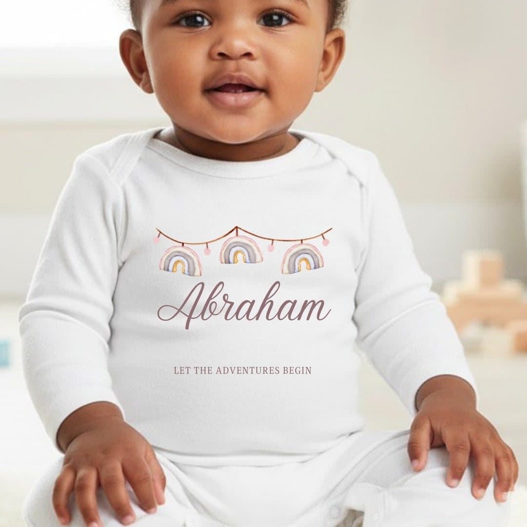 Personalised rainbow bunting baby grow with a name in the design
