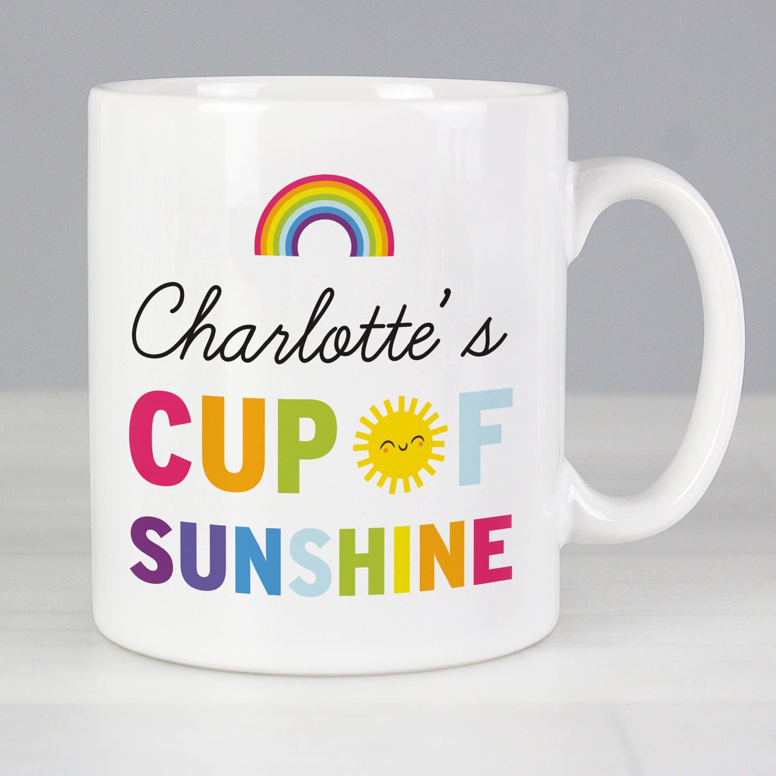 Ceramic rainbow Cup of Sunshine mug with a name on the front