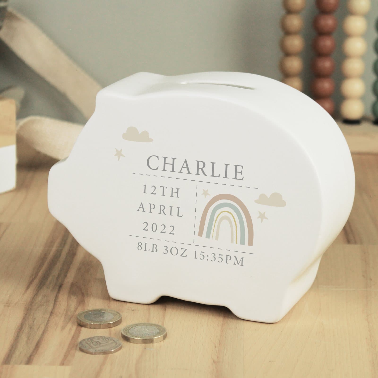Ceramic rainbow piggy bank with personalised lines of text
