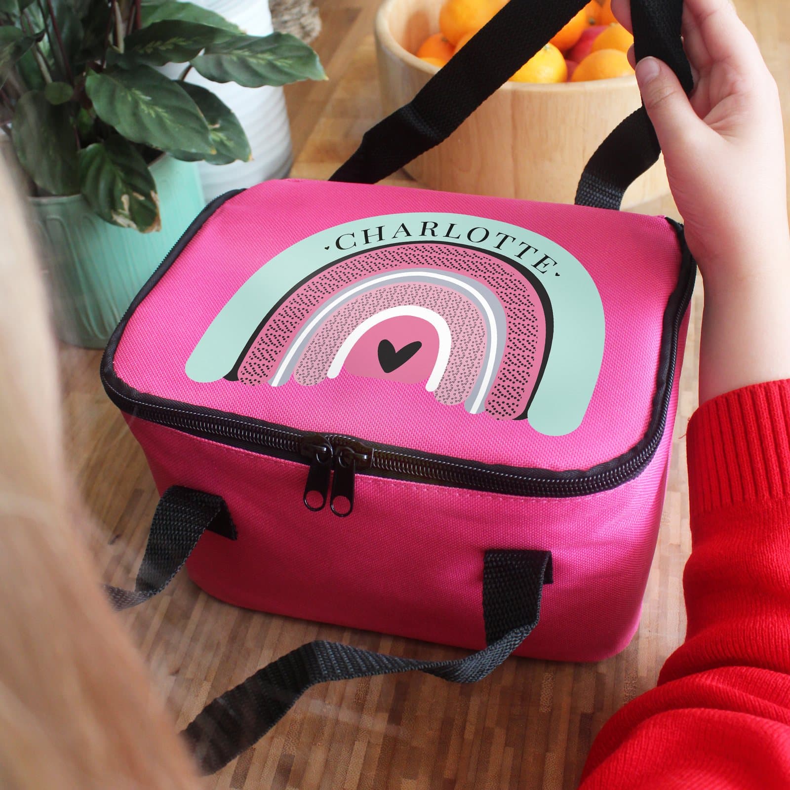 Pink rainbow lunch bag with a personalised name and two carry straps
