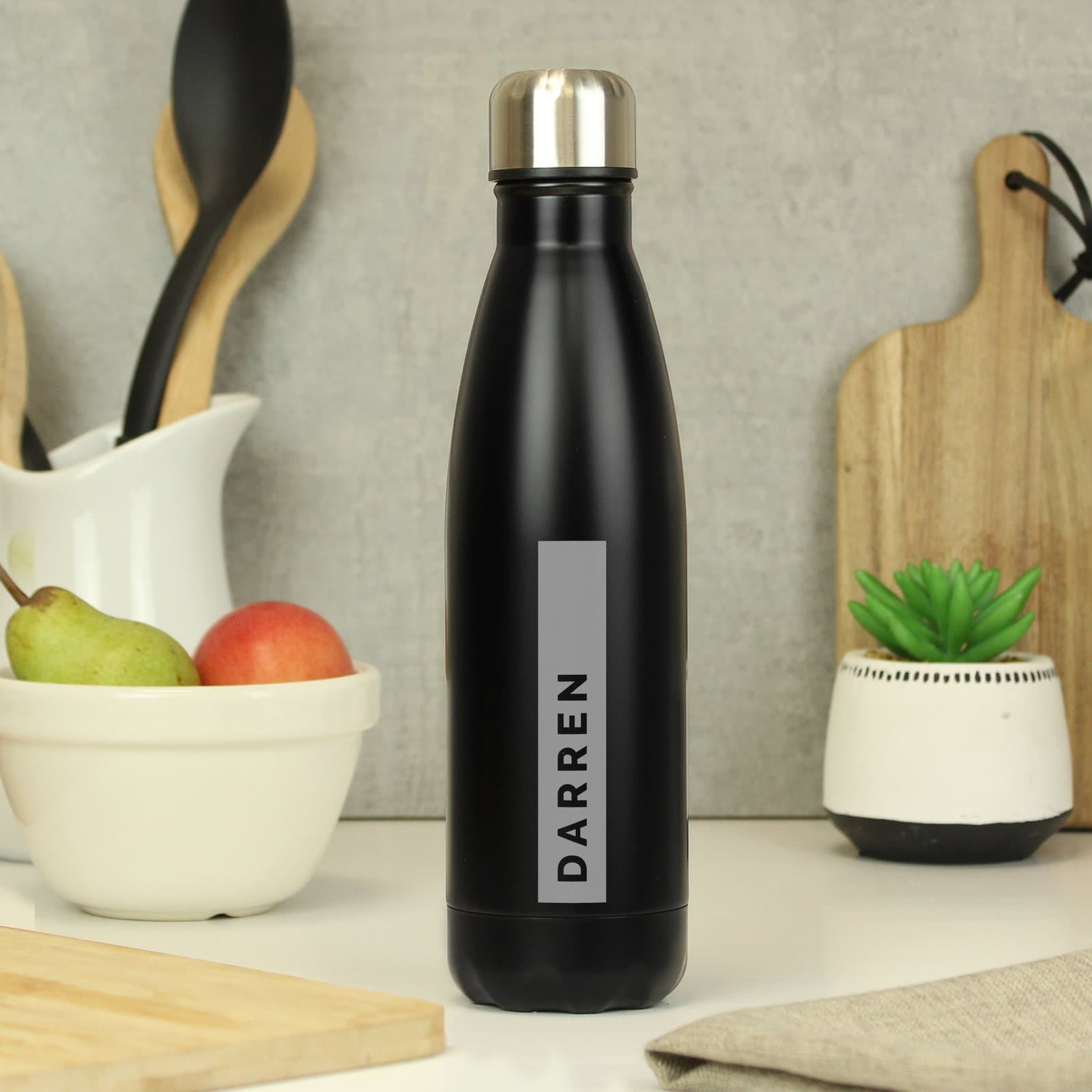 Matte black stainless steel insulated drinks bottle with a screw cap