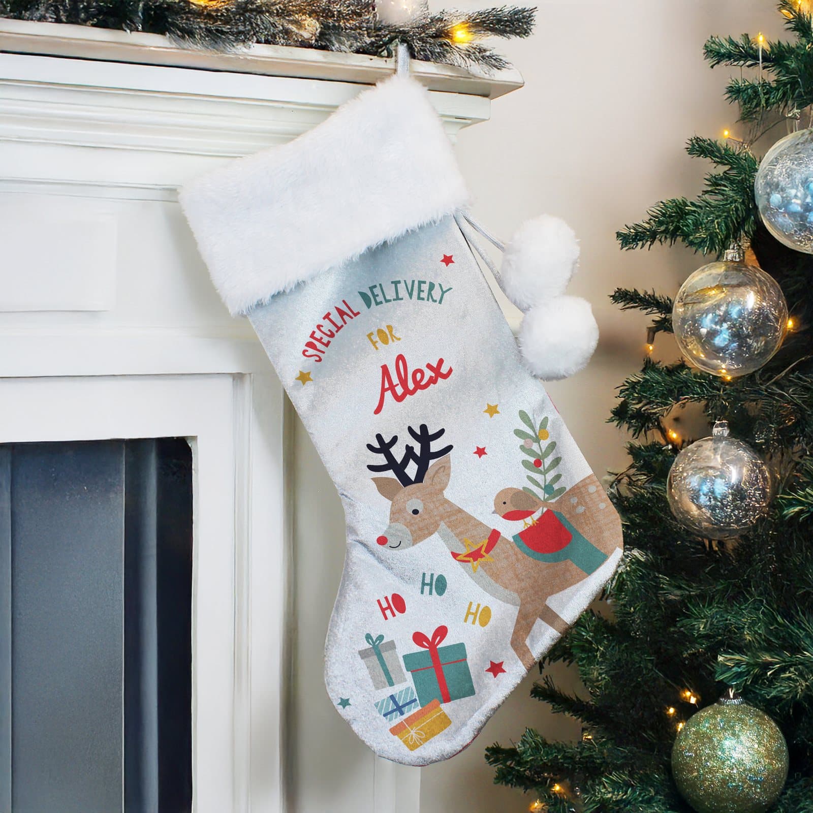 Velvet reindeer Christmas stocking with a plush white cuff and a name