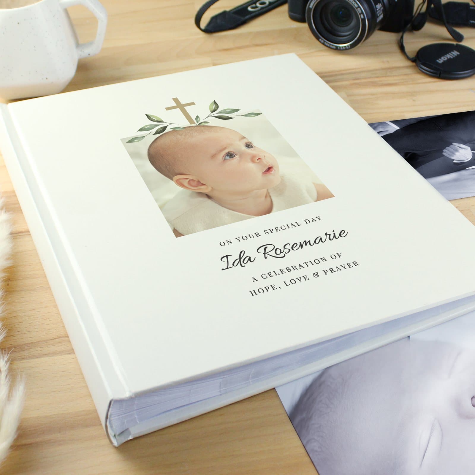 Religious cross traditional photo album with a photo on the cover