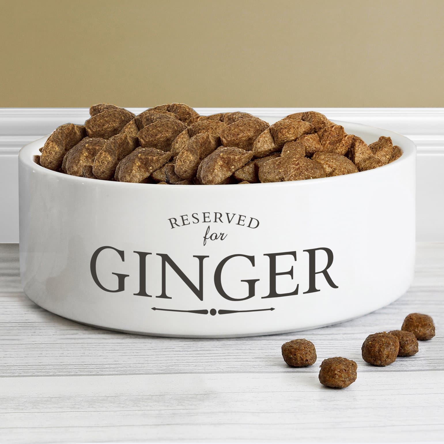 White ceramic pet bowl printed with RESERVED for and a pet's name