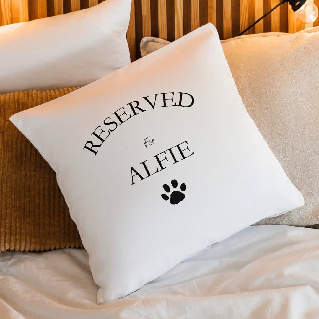 Cream linen-look personalised cushion with a paw print design and a name