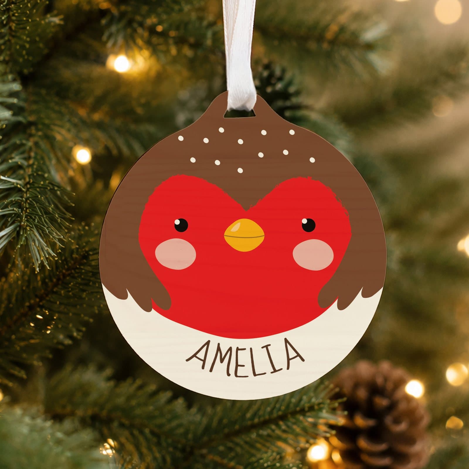 Round wooden bauble with a cartoon robin design and a name