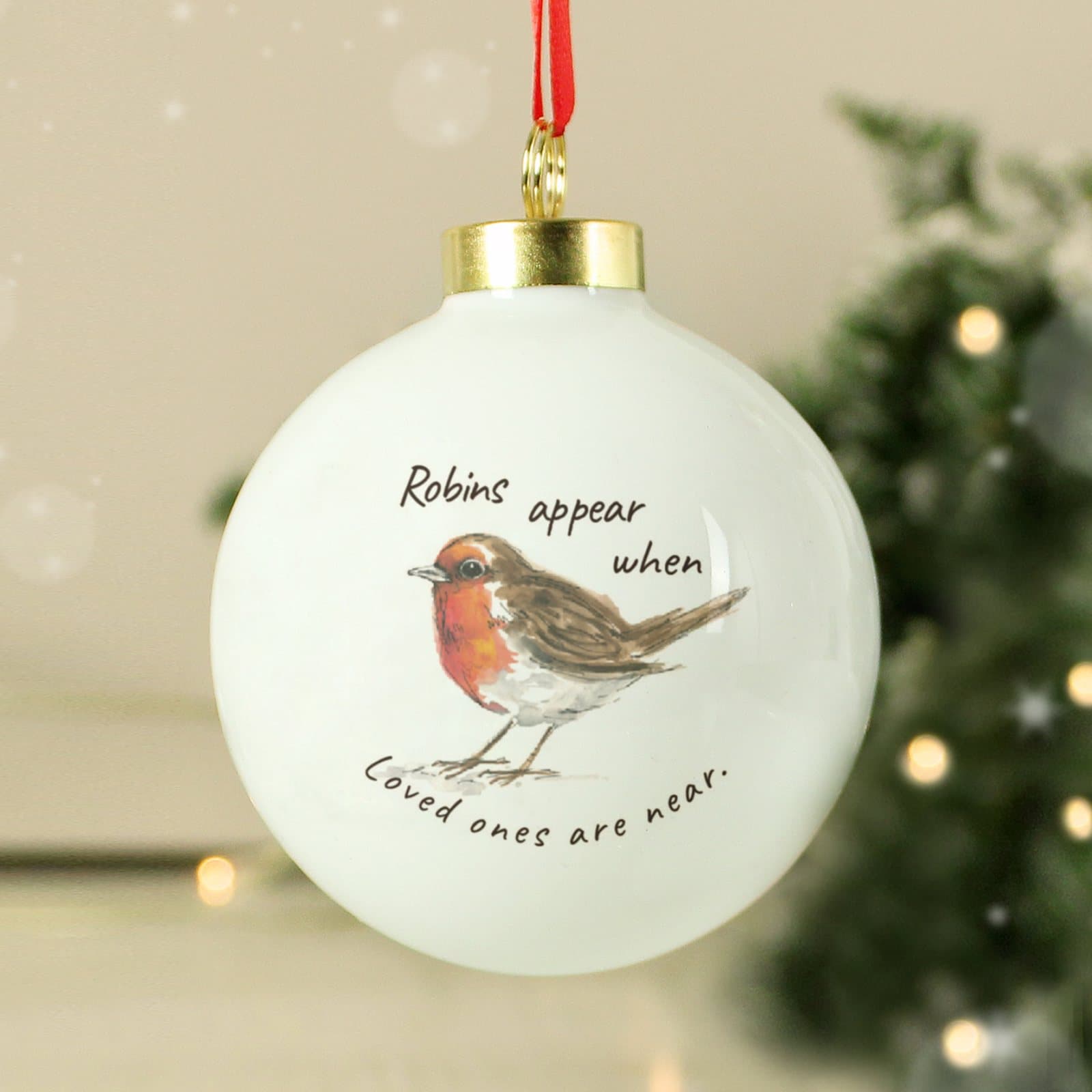 Ceramic robins appear memorial bauble with a red ribbon