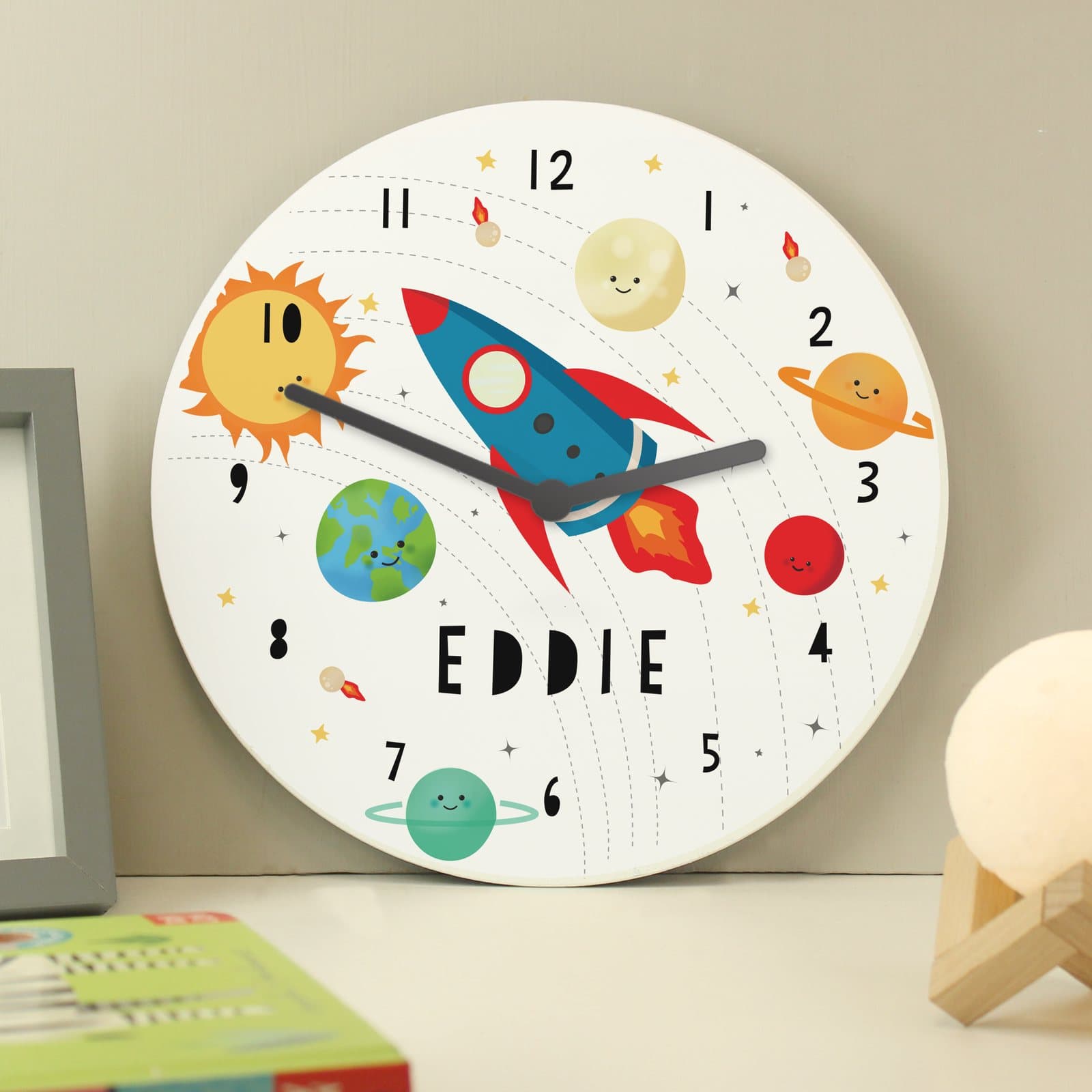Large wooden clock with a rocket in space solar system design
