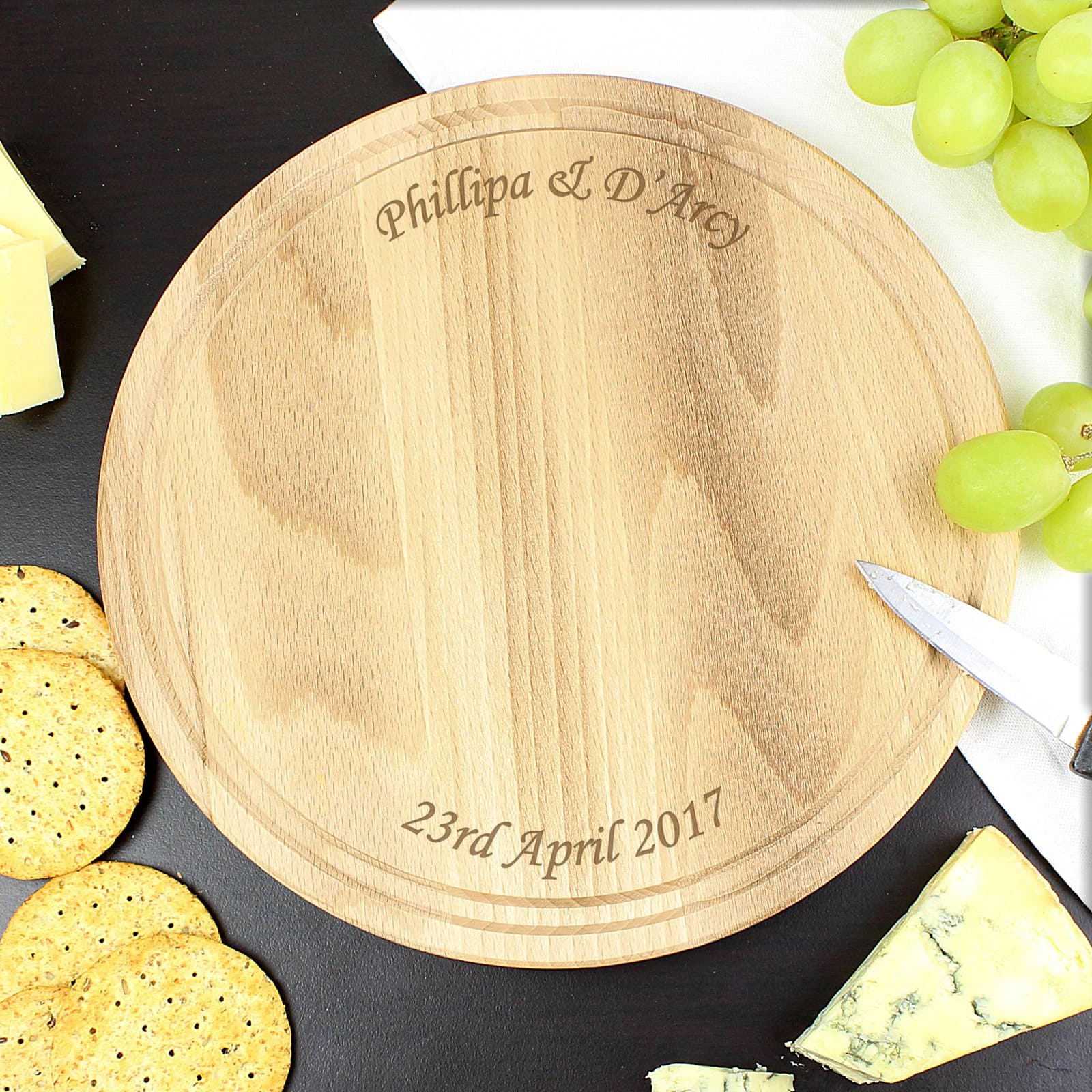 Round wooden chopping board with text above and below
