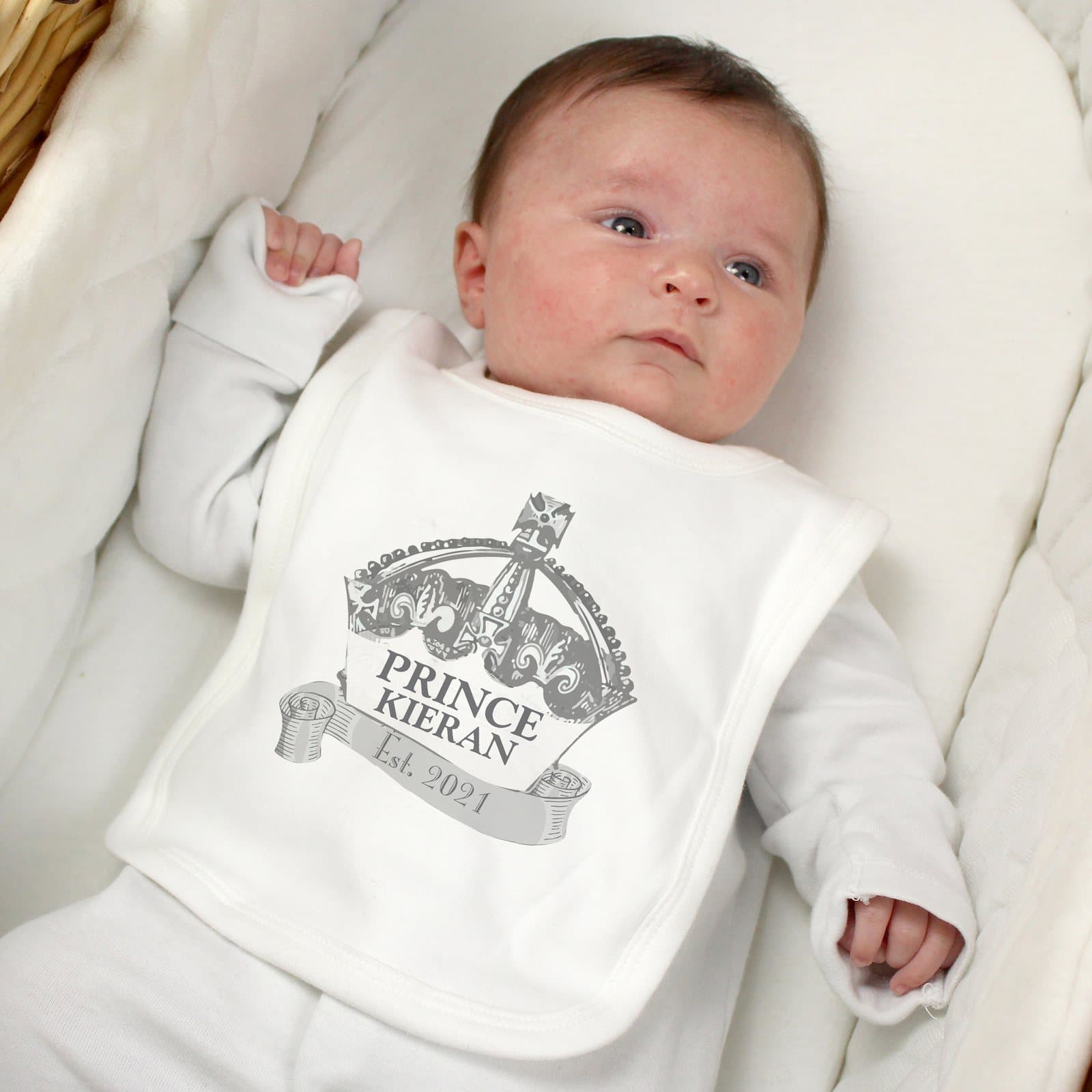 Baby bib with a royal crown design and three lines of personalised text
