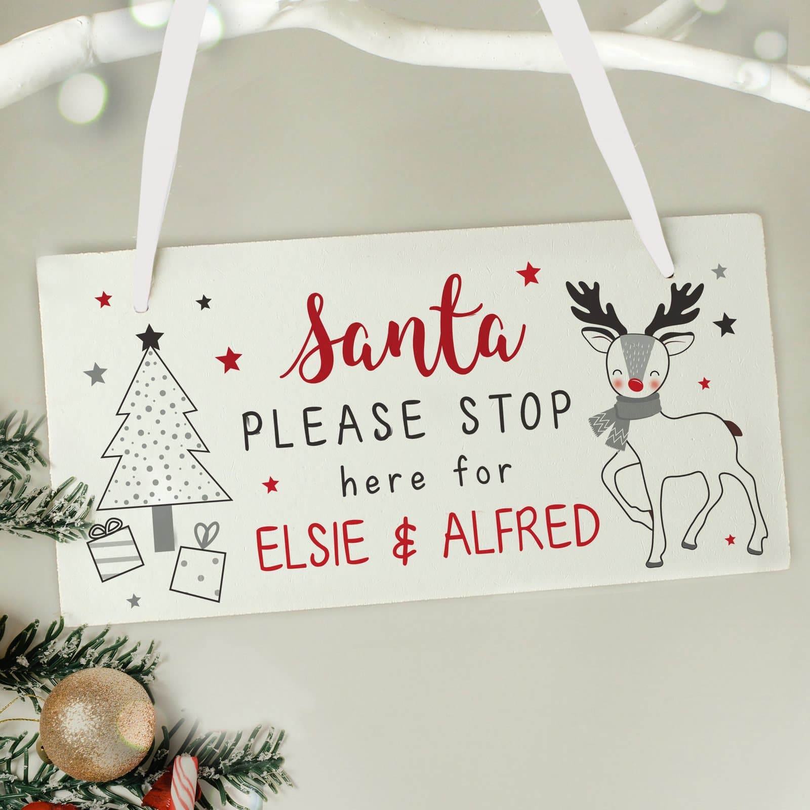 Wooden Rudolph Santa please stop here sign with ribbon