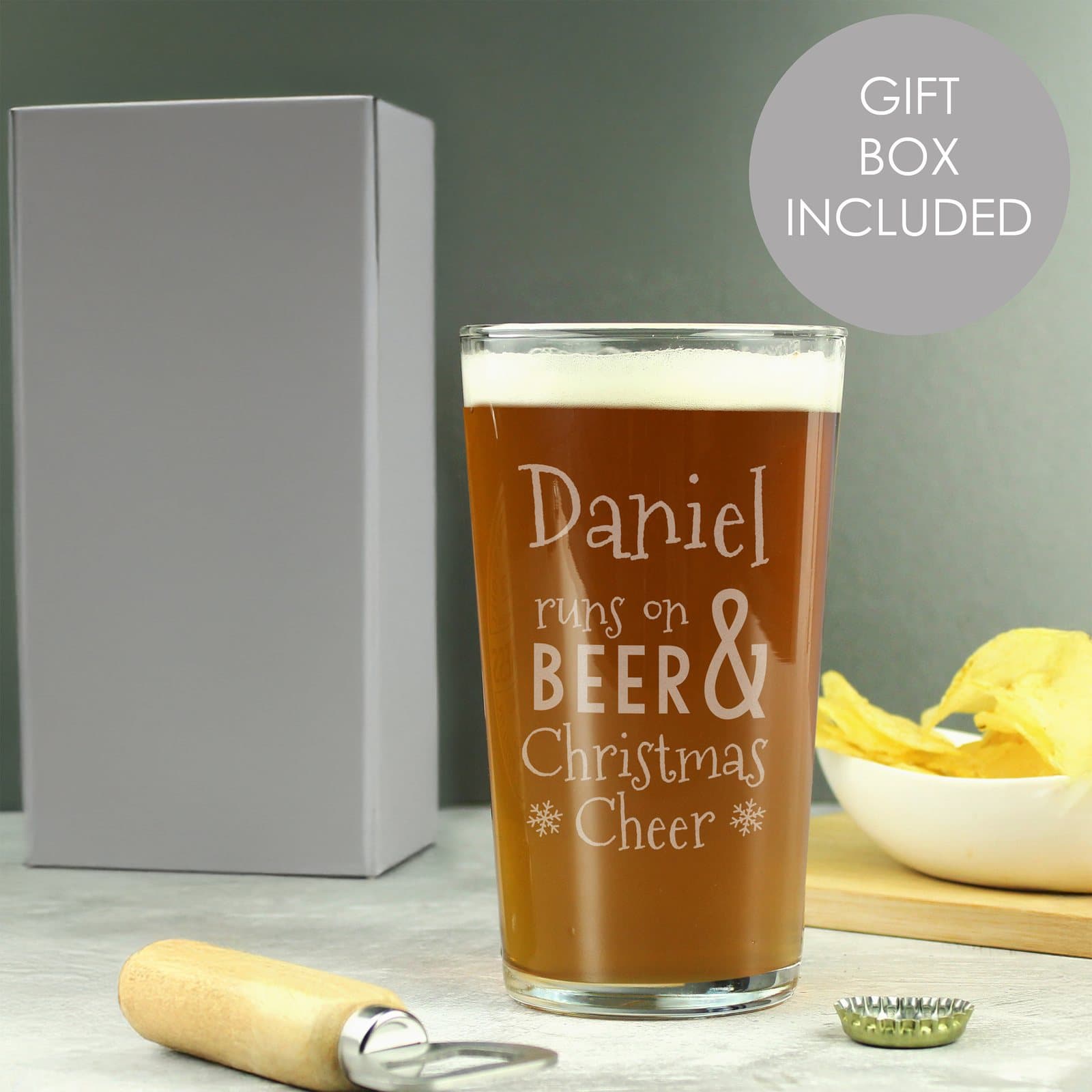 Pint glass with runs on beer and Christmas cheer wording and a name