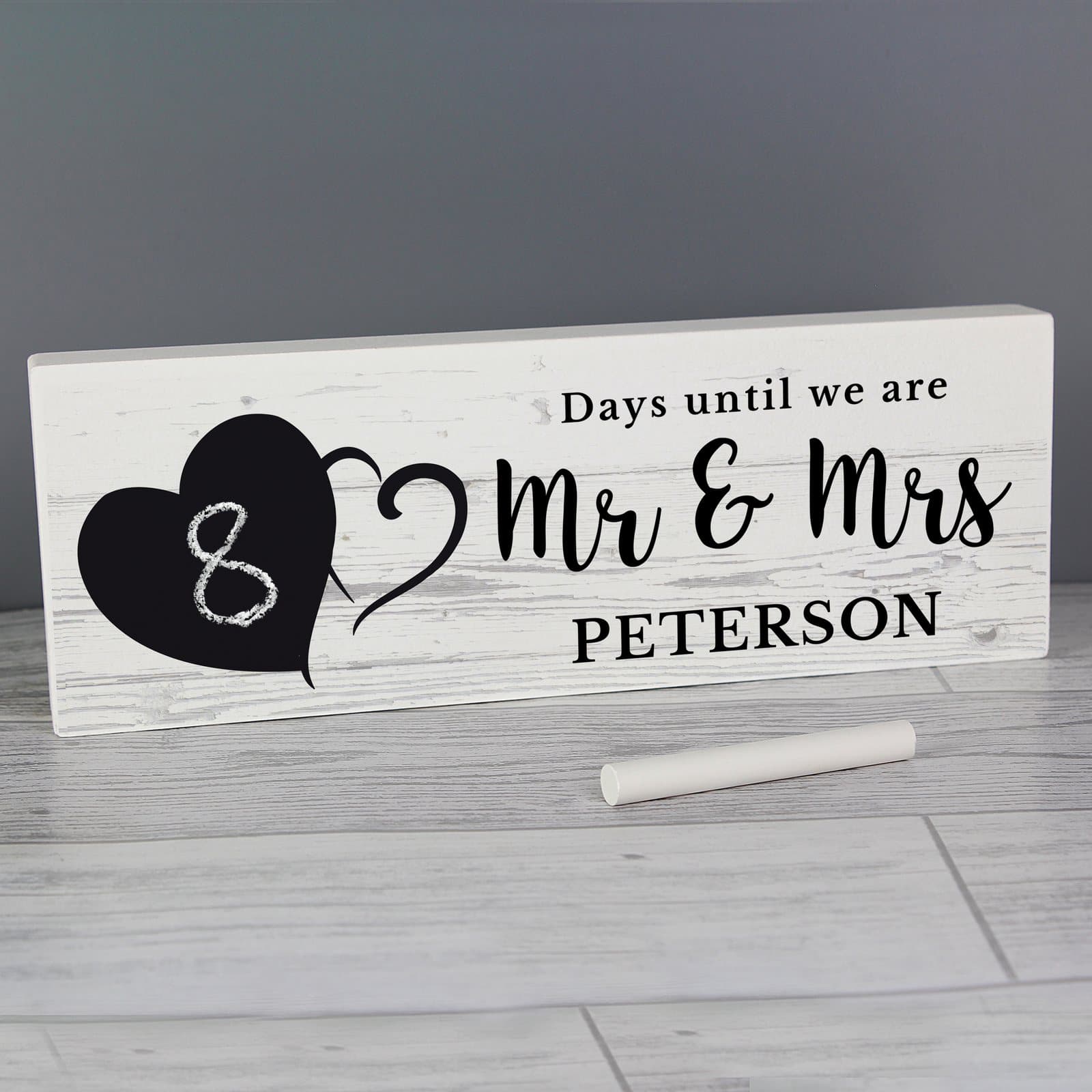 Rustic wooden countdown block sign with a chalkboard style area
