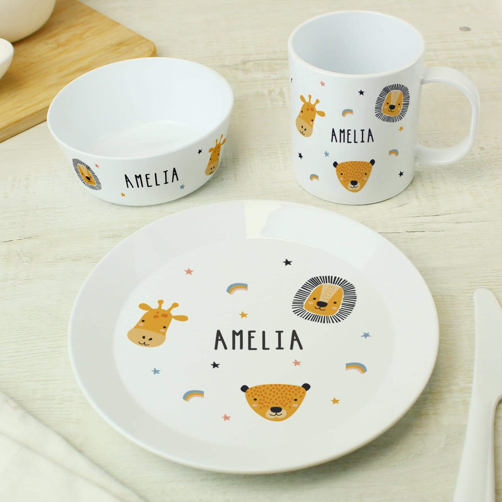 Plastic plate, bowl and mug in a safari animals design with a name