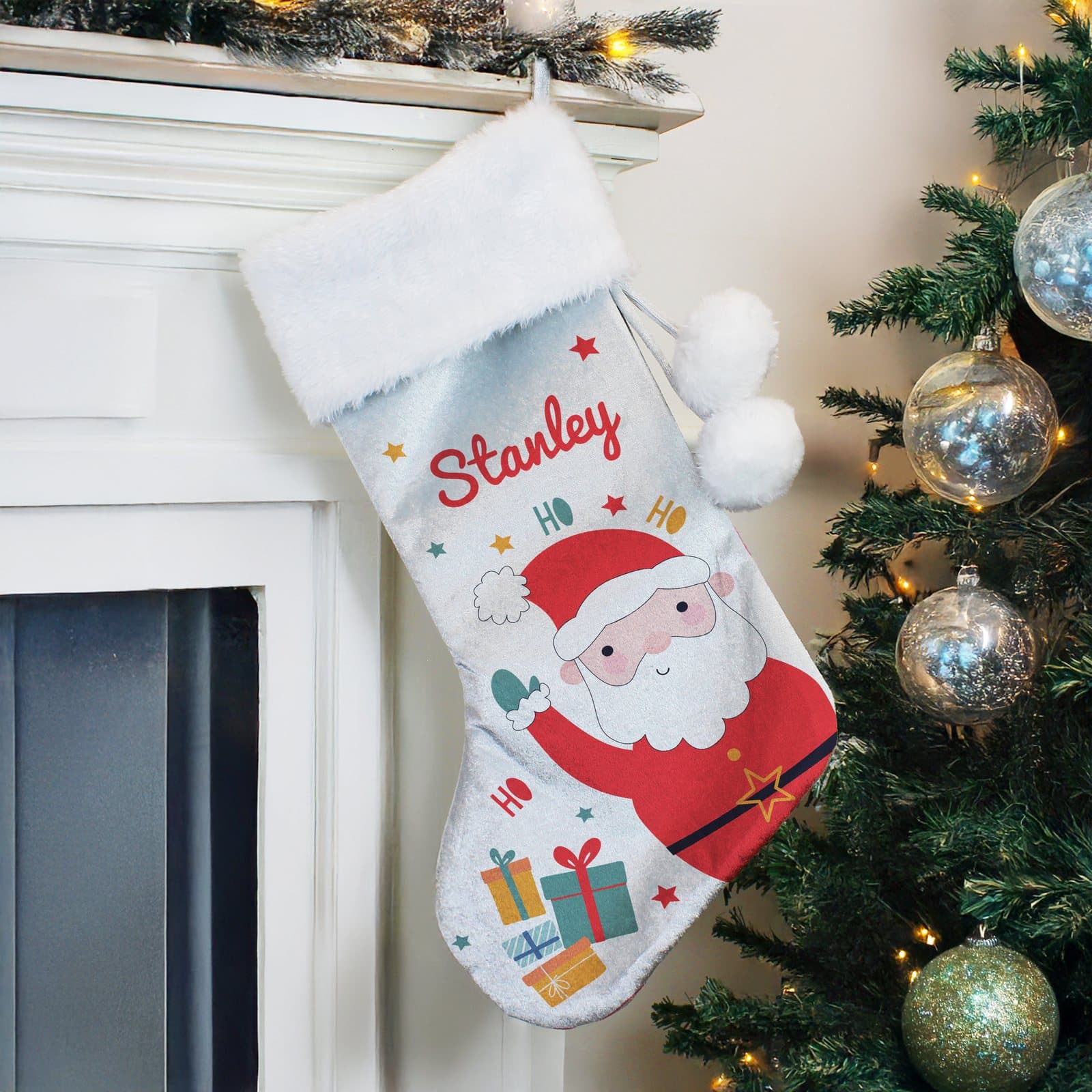 Grey velvet Santa Christmas stocking with a plush white cuff and a name