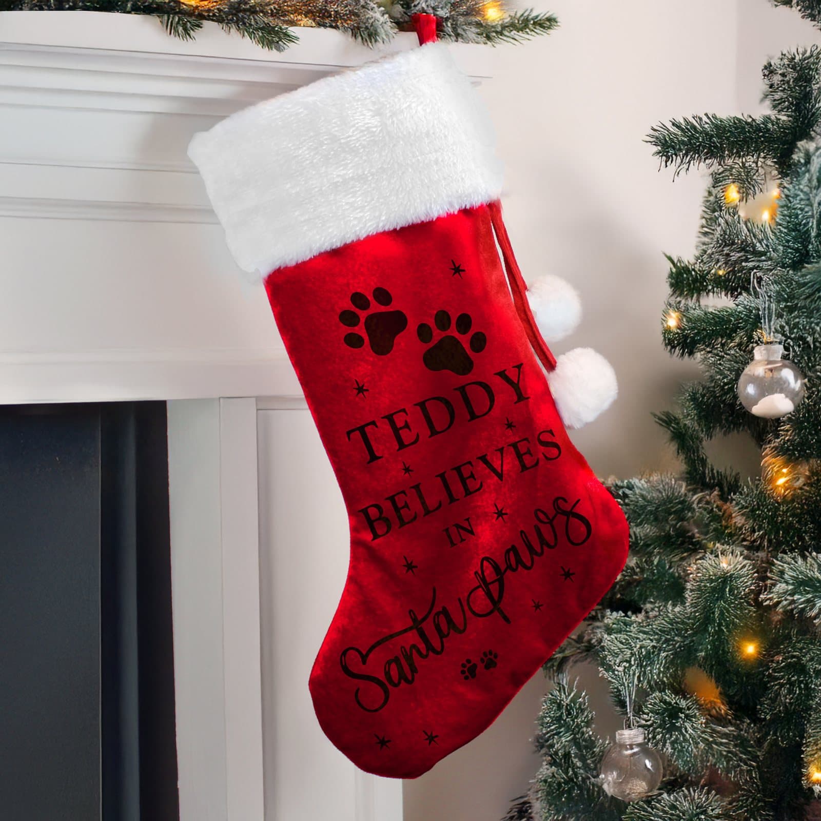 Red velvet Santa Paws Christmas stocking with a plush white cuff and a pet name
