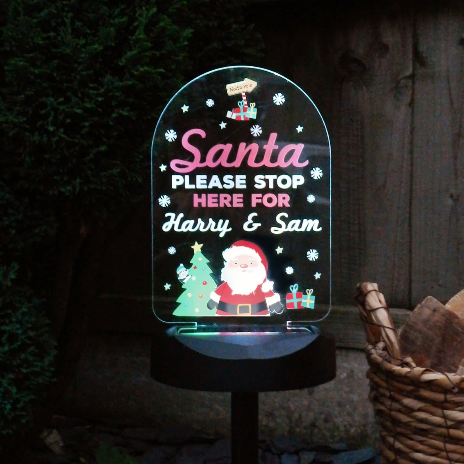 Santa stop here solar LED sign on a ground stick with solar panel base