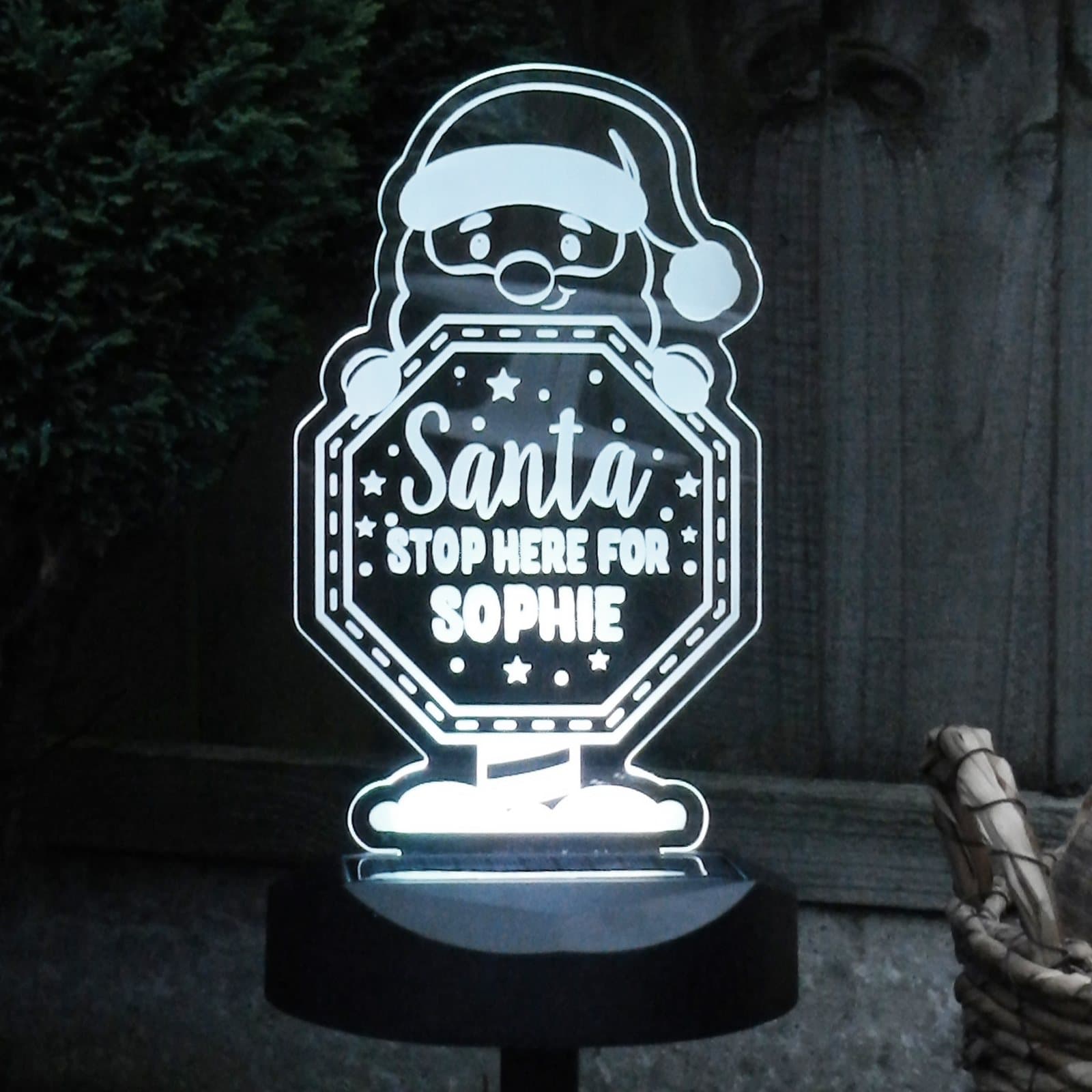 Santa stop here sign solar LED light on a ground stick and solar base