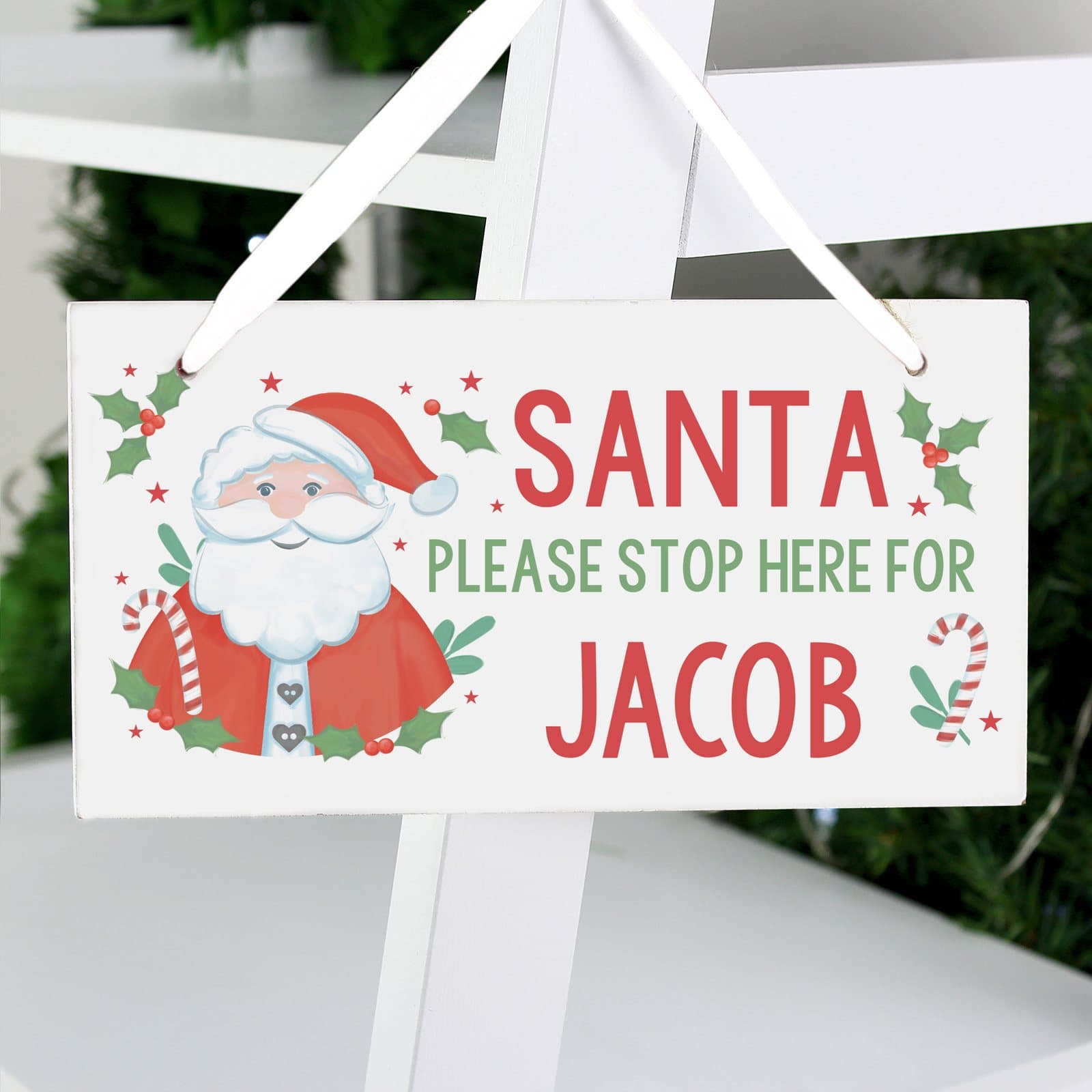 Wooden Santa stop here sign with ribbon and a personalised name