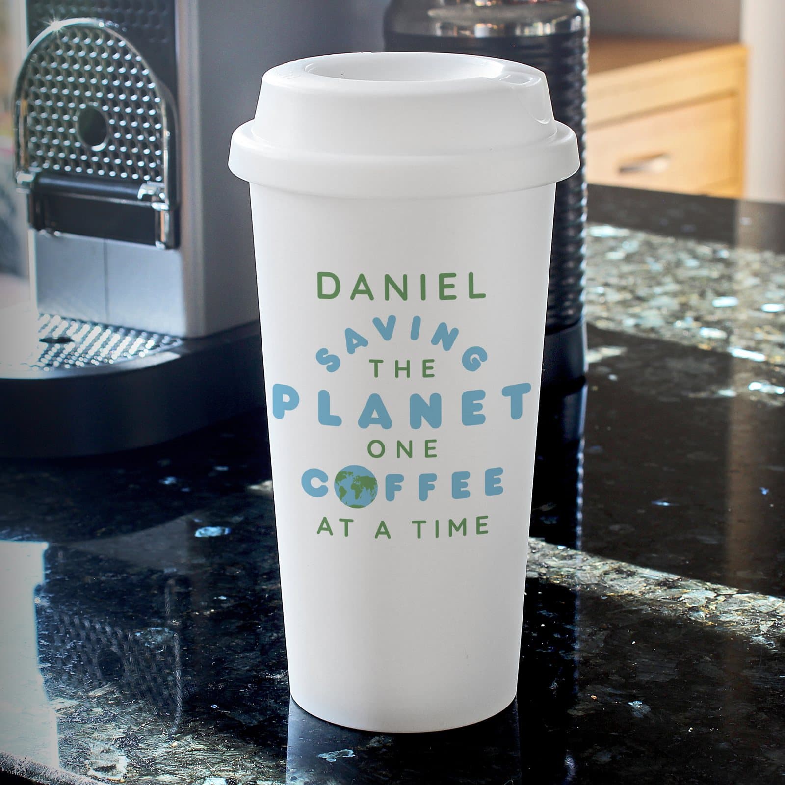 Reusable plastic travel mug with screw-on lid and Saving the Planet slogan