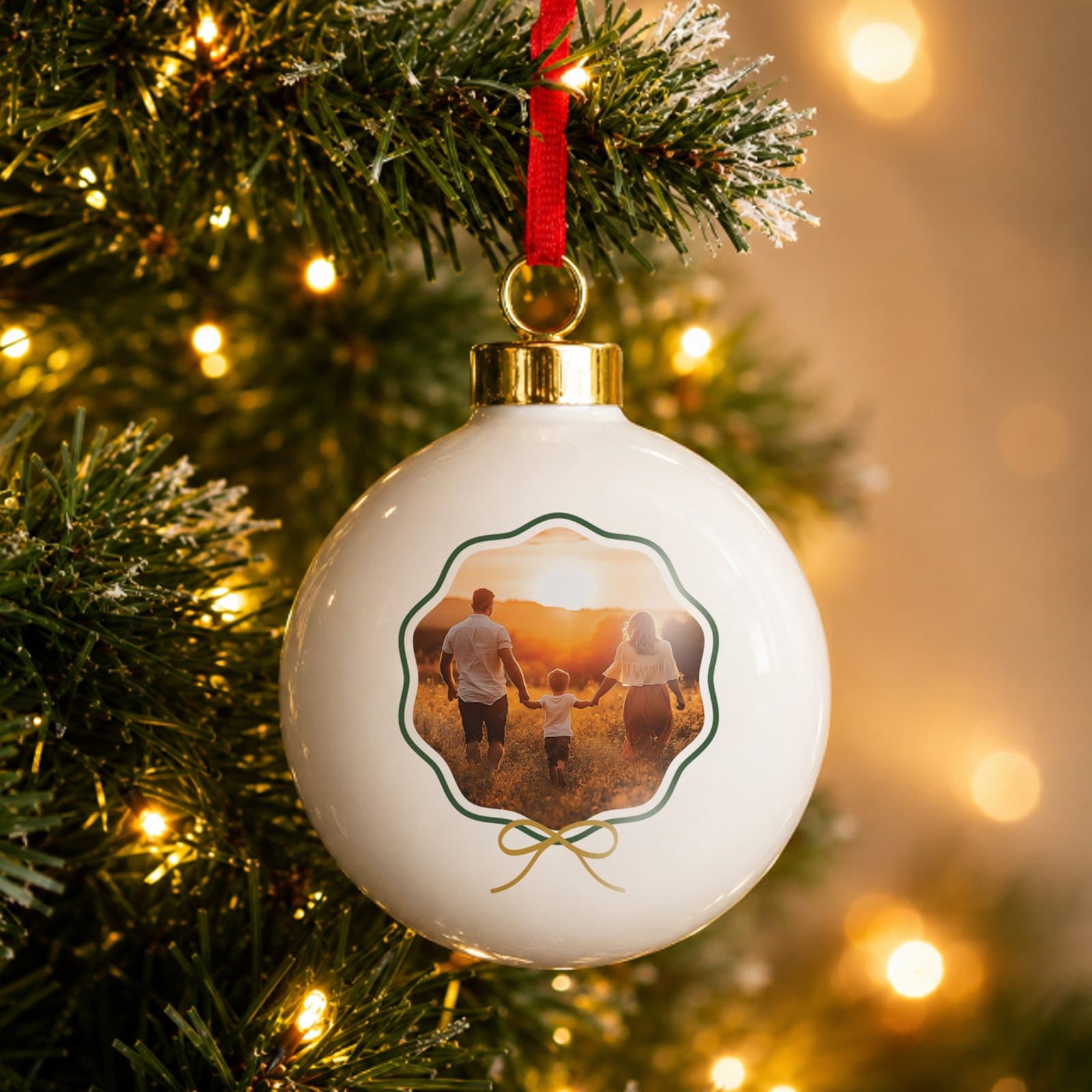 Ceramic scallop bow photo bauble with a ribbon