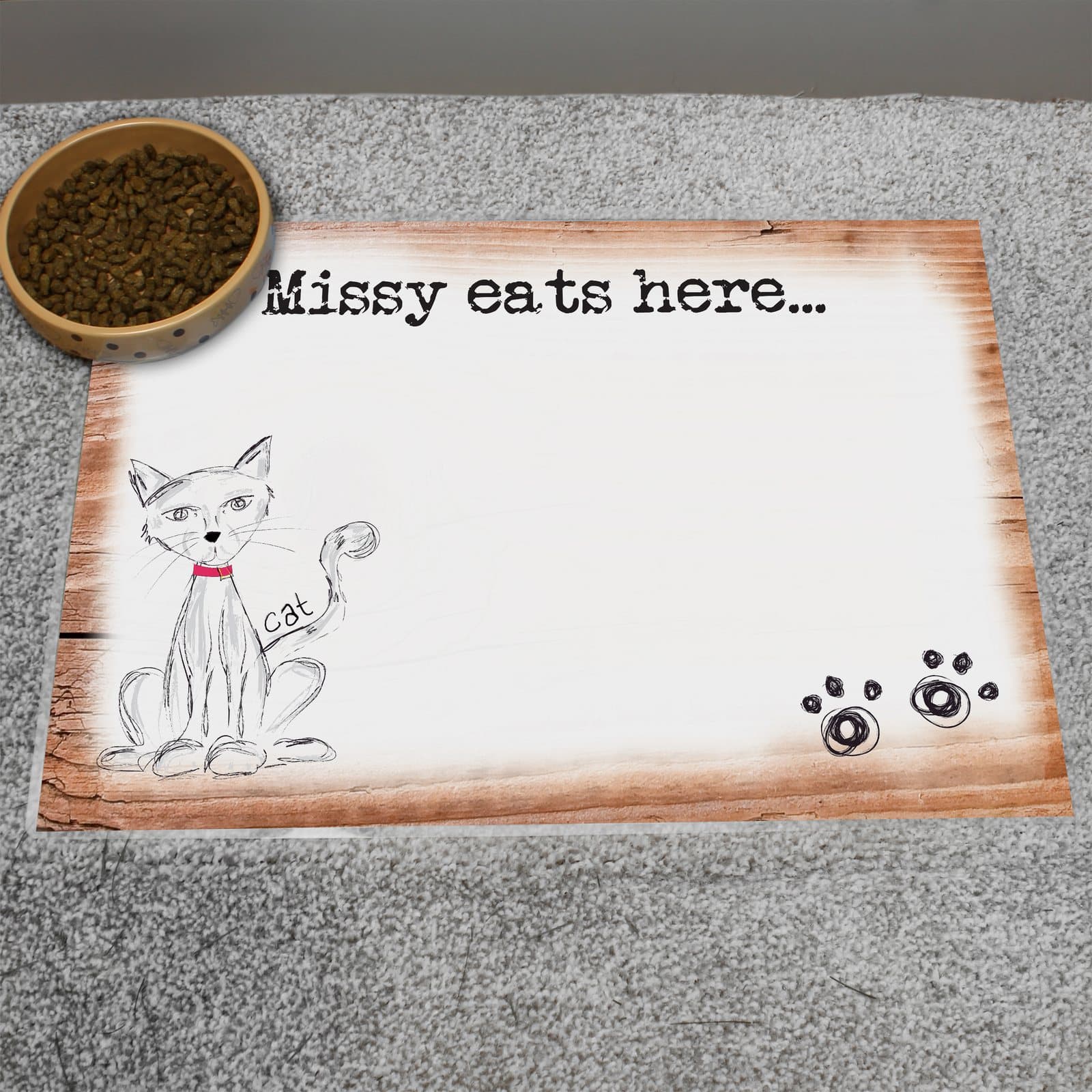 Scribble cat pet bowl mat with a personalised message along the top