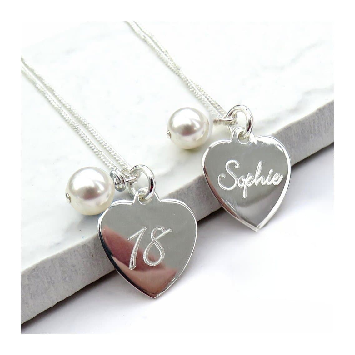Sterling silver script heart necklace with a pale ivory pearl on a fine chain