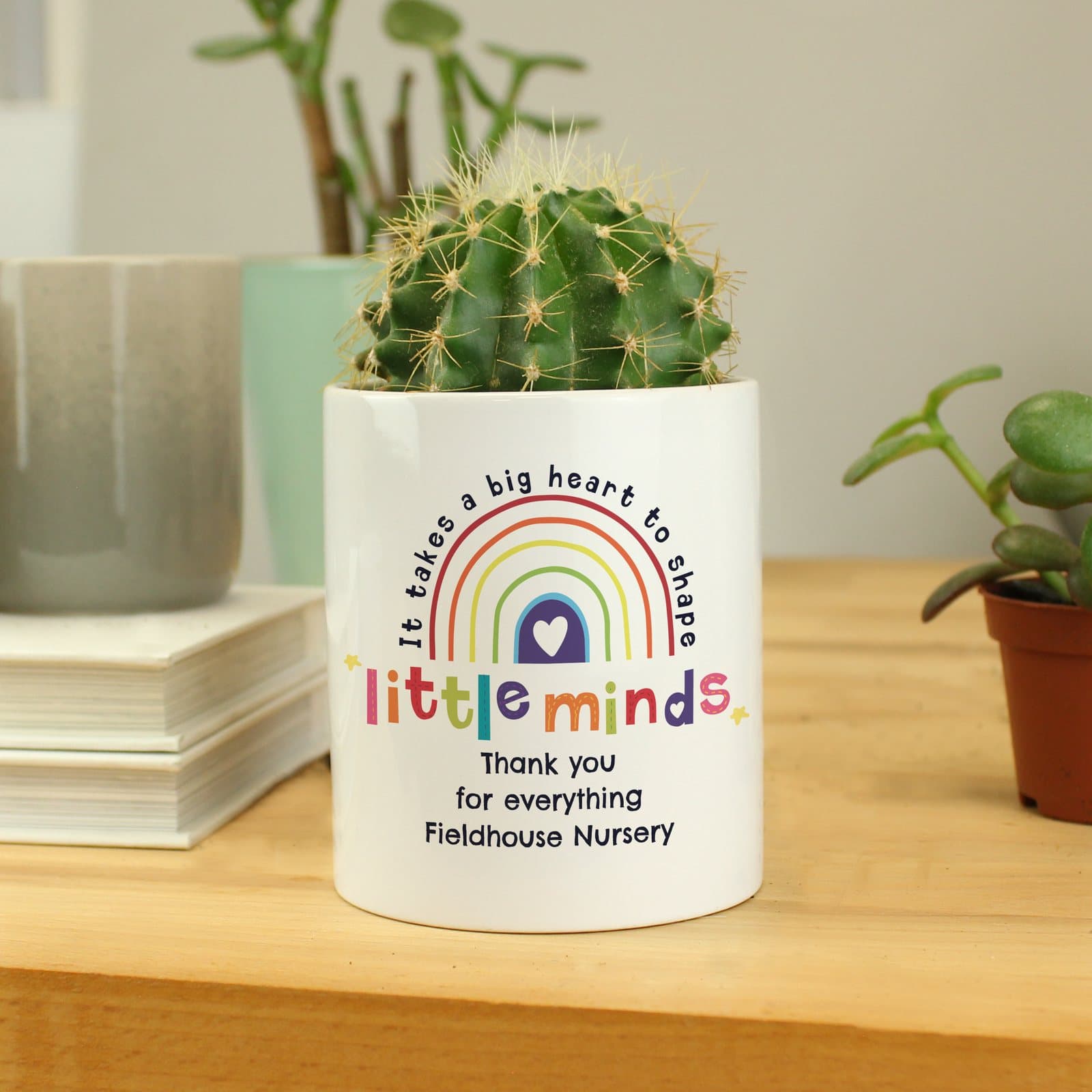Ceramic storage pot with the words It takes a big heart to shape little minds