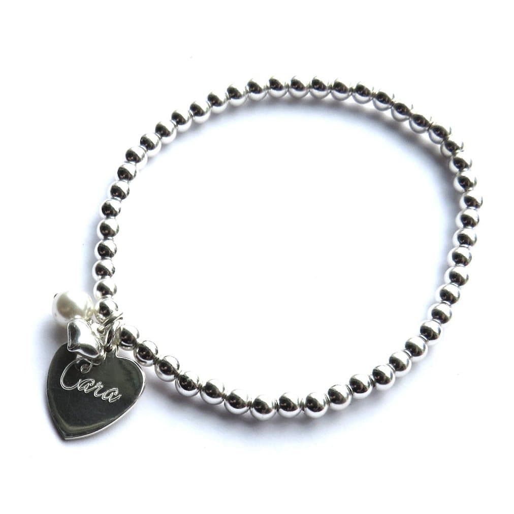 Personalised silver beaded bracelet with a sterling silver heart and ivory pearl