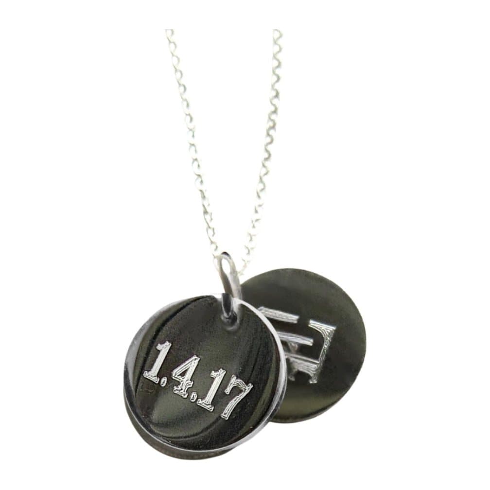 Silver double mini disc necklace with two engraved discs on a fine chain