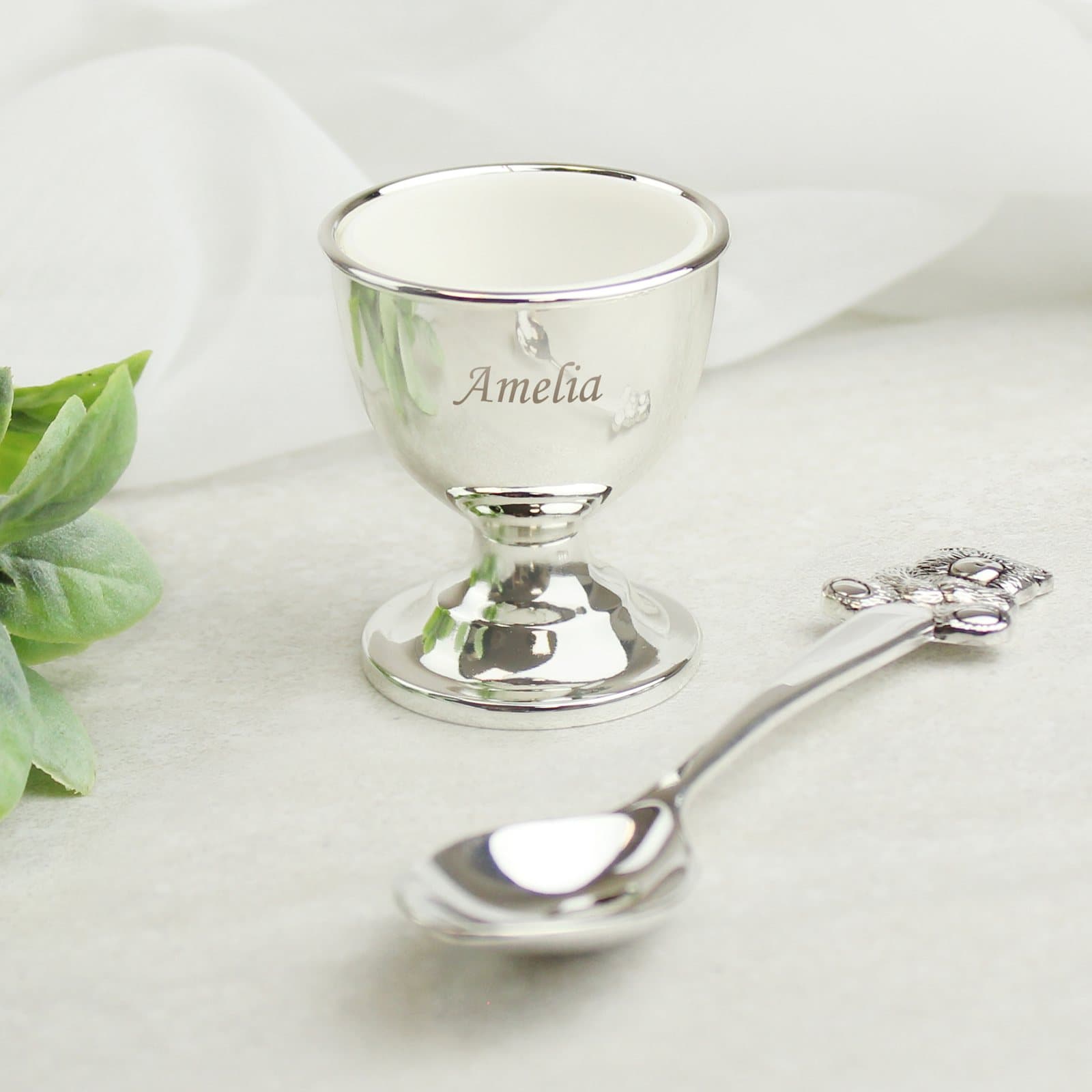 Silver plated egg cup and spoon set with a name engraved on the egg cup