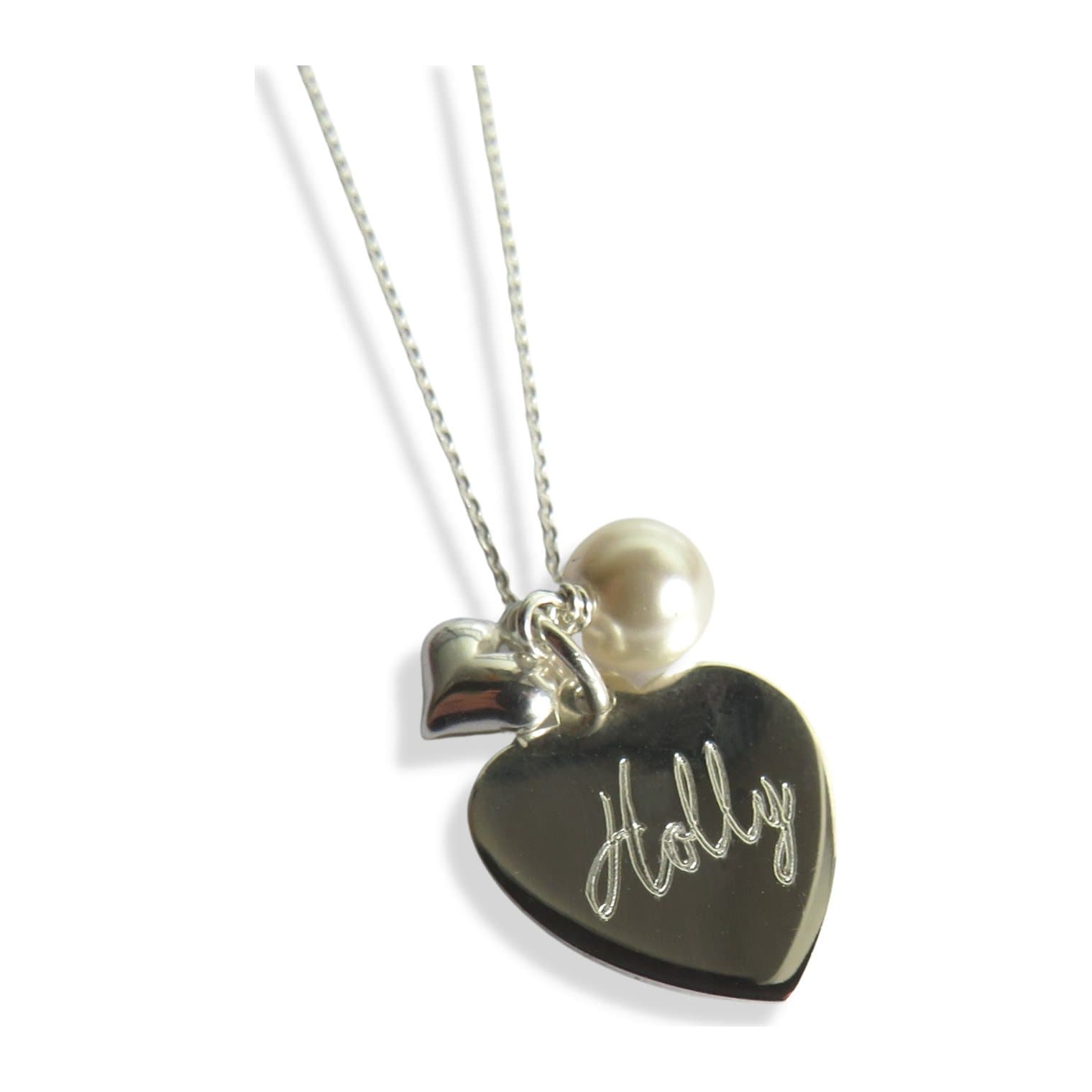 Silver heart necklace with a pale ivory pearl and a mini silver heart charm