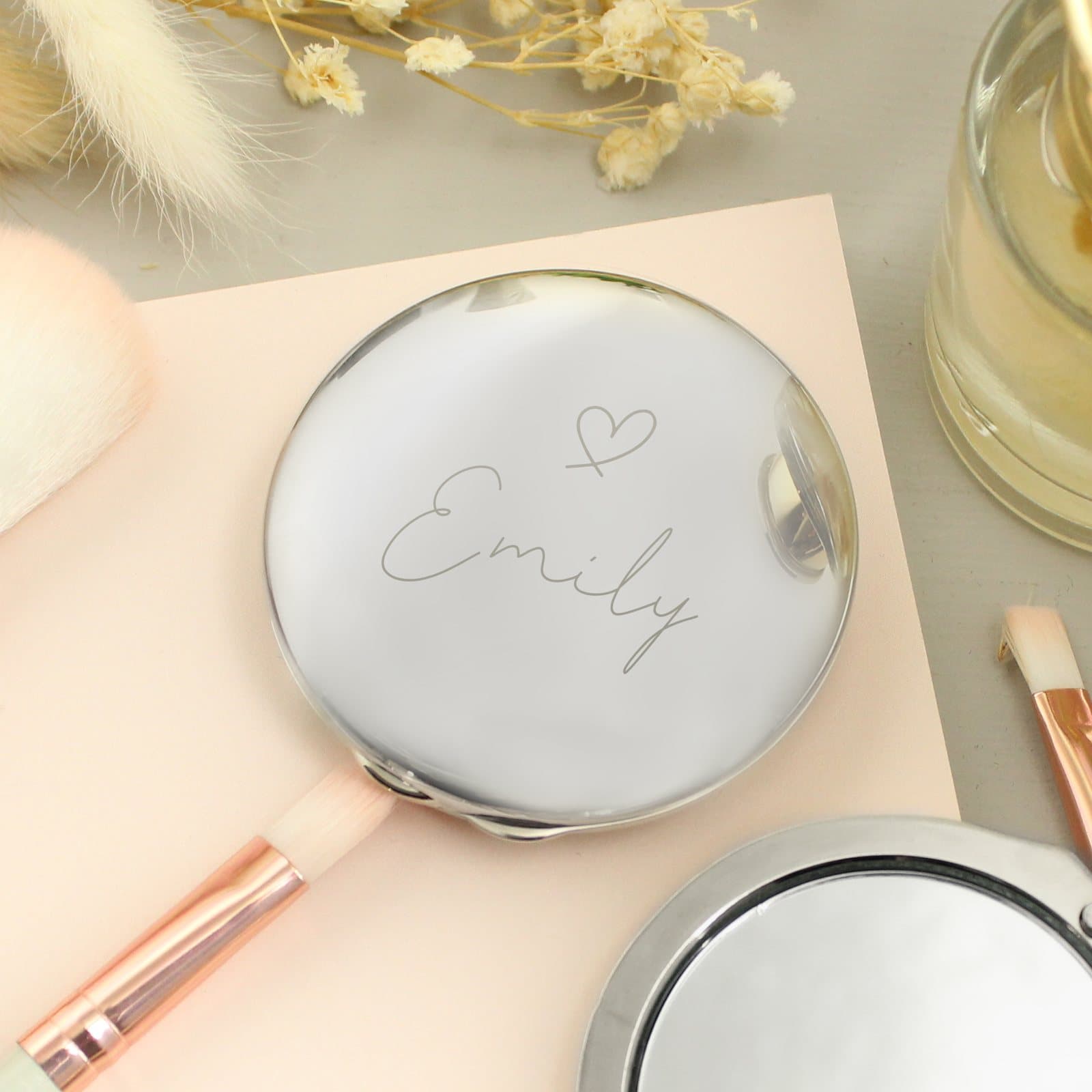 Round silver compact mirror with a heart motif and a personalised name