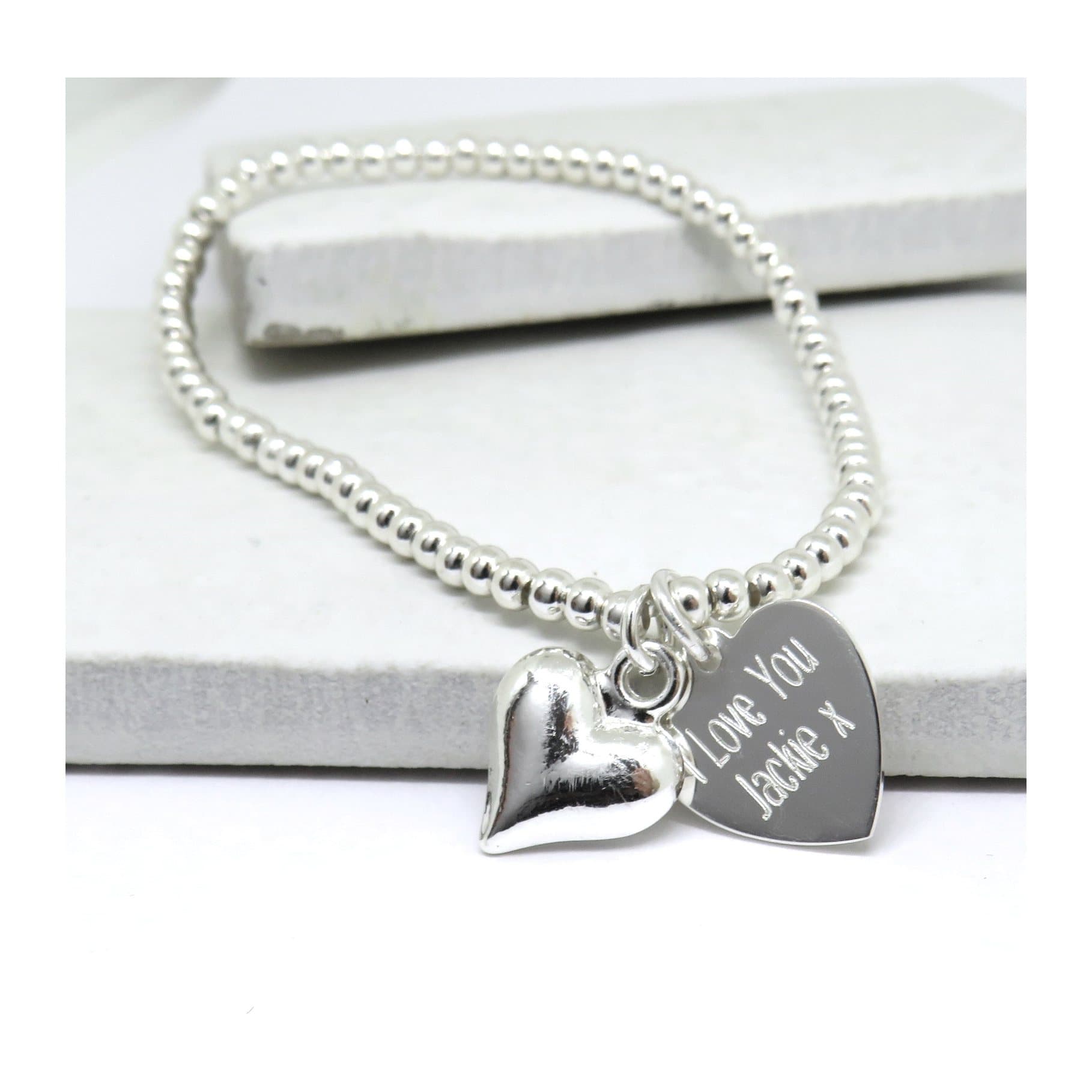Silver heart stretch beaded bracelet with a sterling silver heart charm