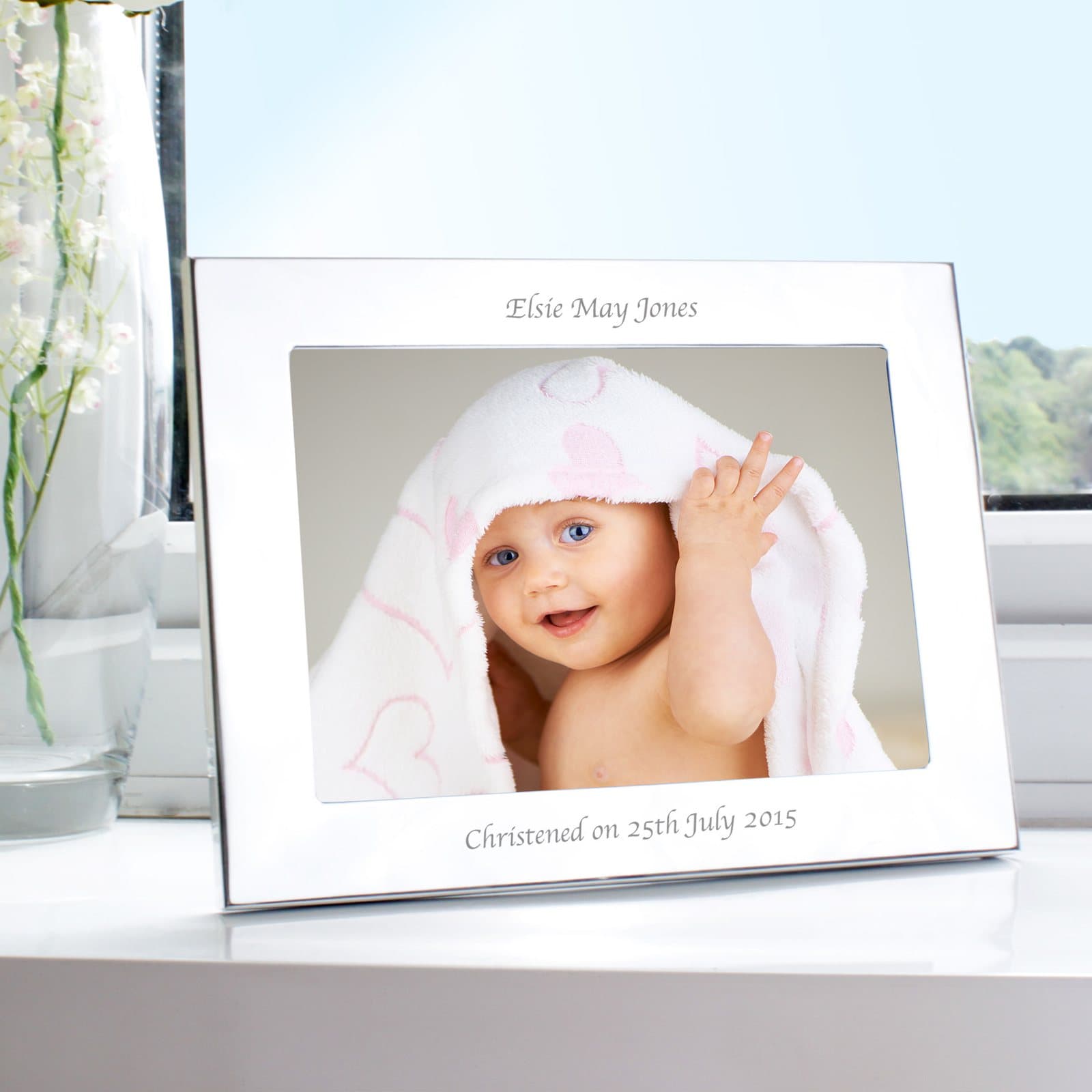 Silver landscape photo frame with a personalised line above and below the photo