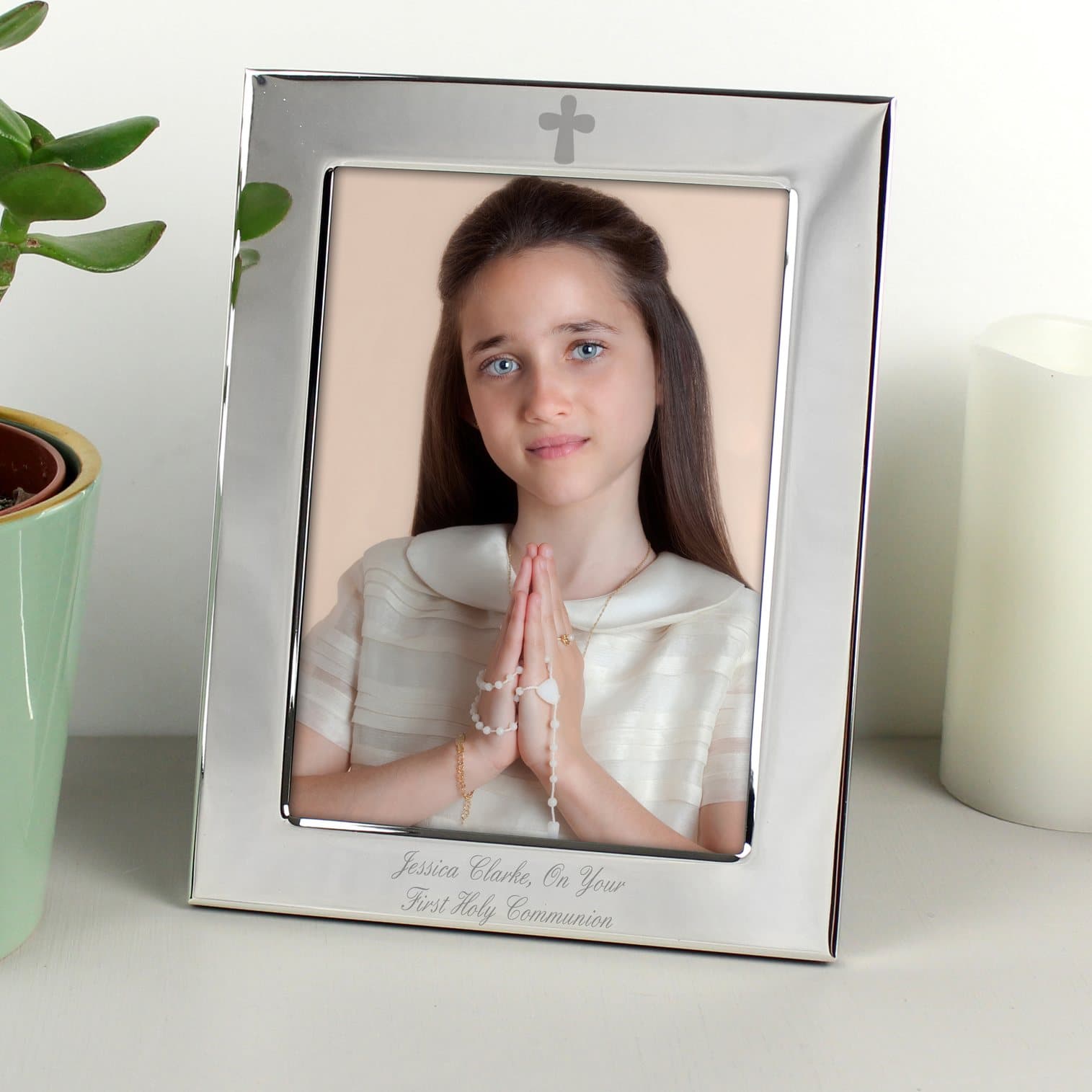 Silver plated 6x4 photo frame with an engraved cross motif