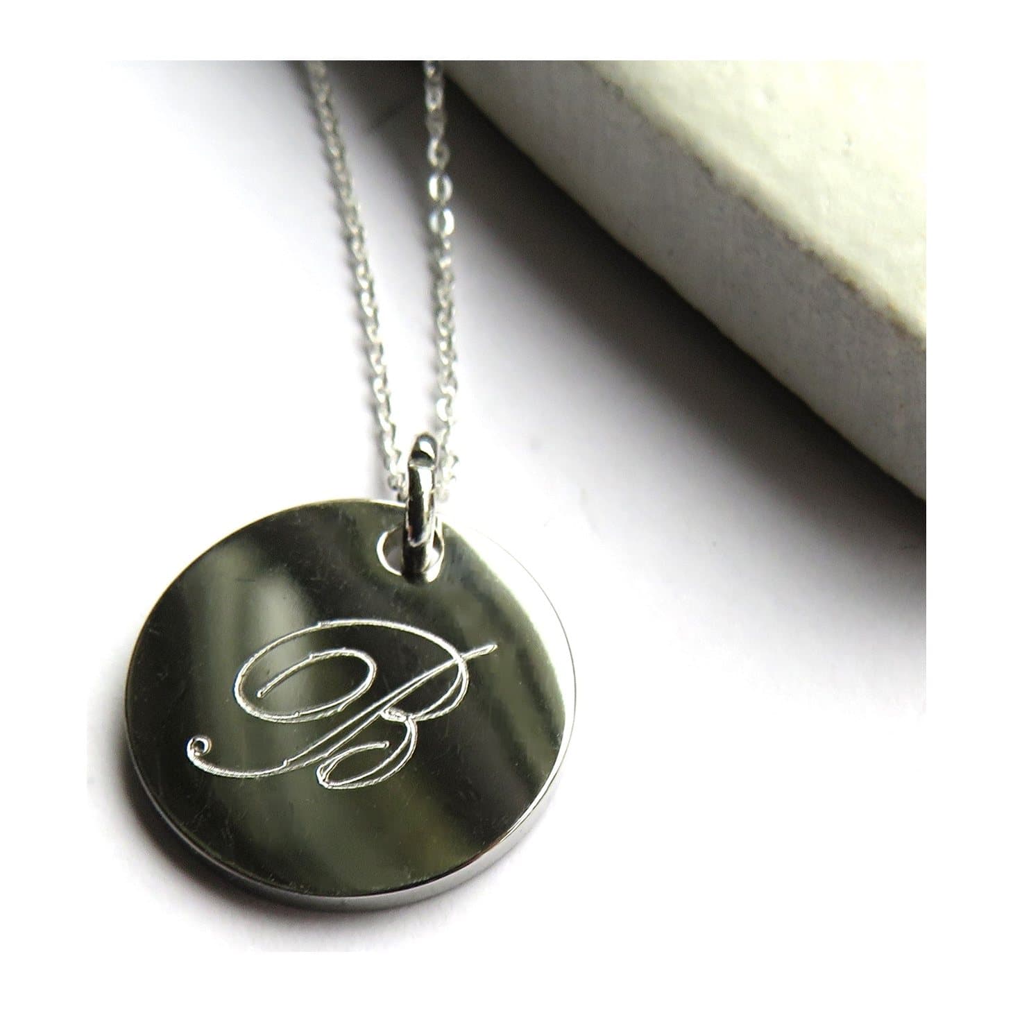 Silver personalised single letter necklace with a round initial charm on a silver chain.
