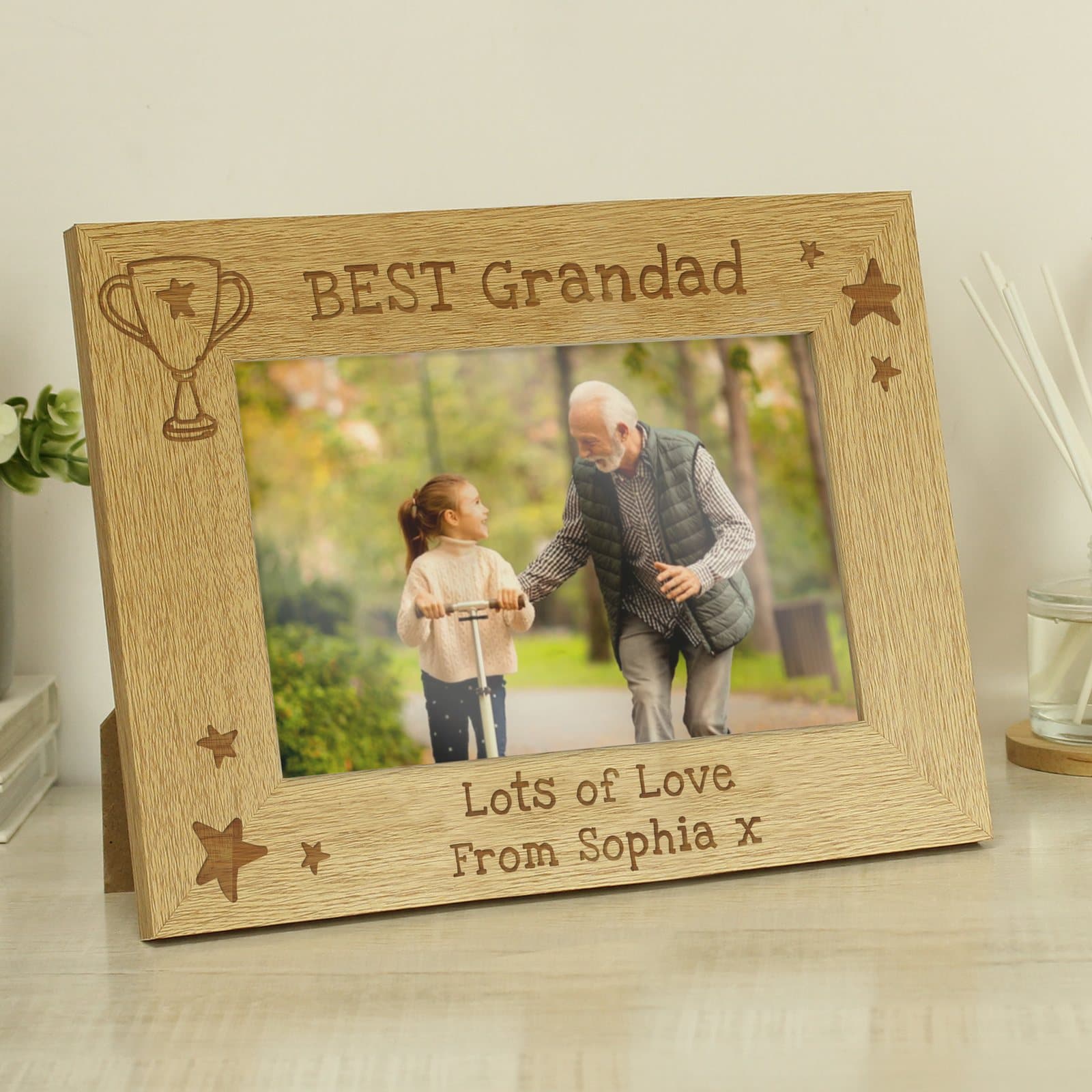 Wooden landscape photo frame with a bold trophy icon in the top left corner
