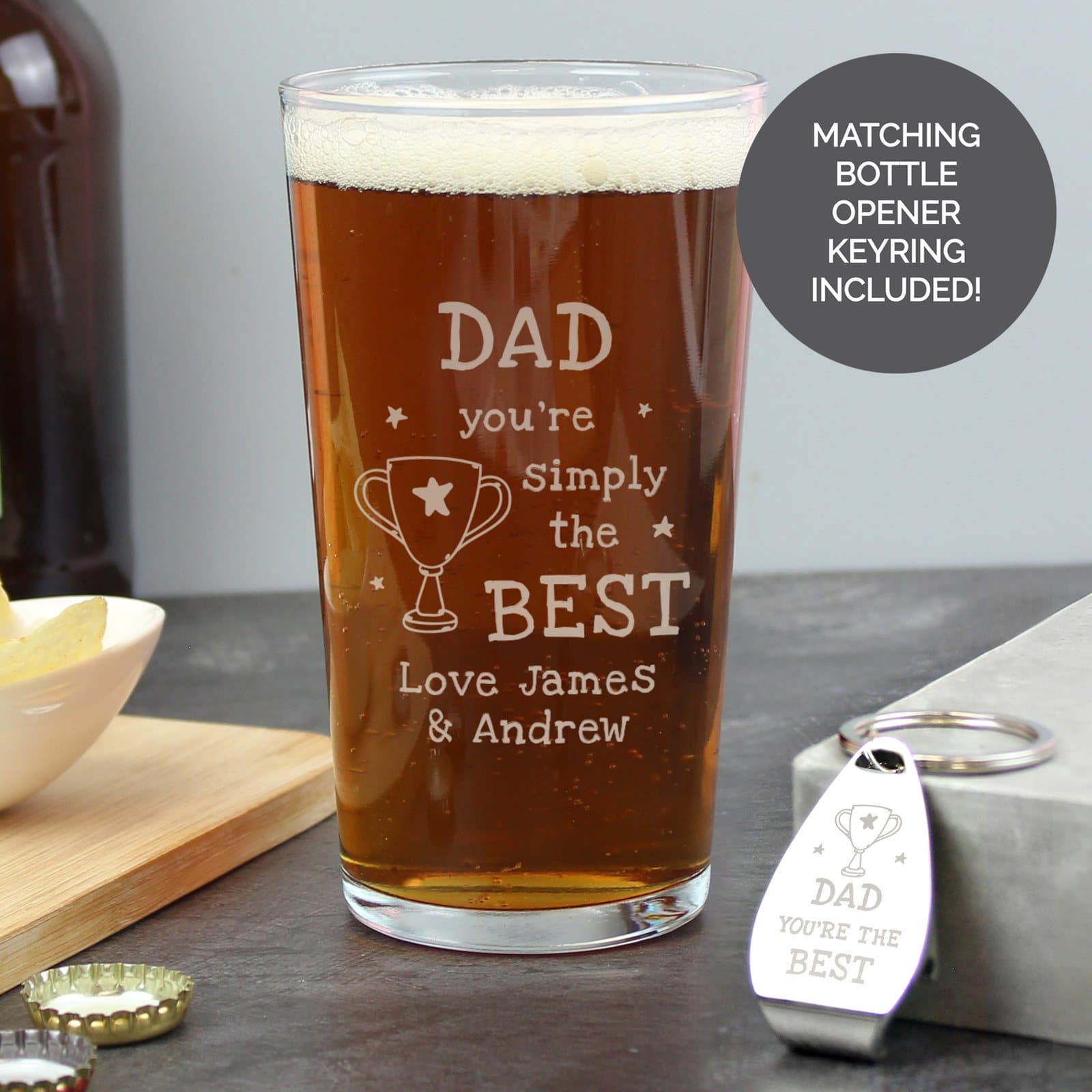 Pint glass with a trophy design and a matching metal bottle opener keyring
