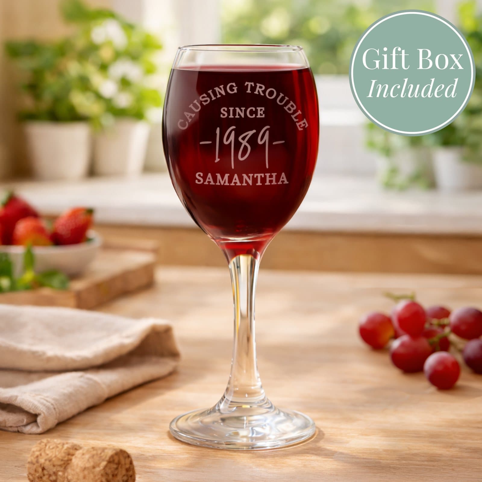 Personalised wine glass with a message, year and name, shown with a silver folding box