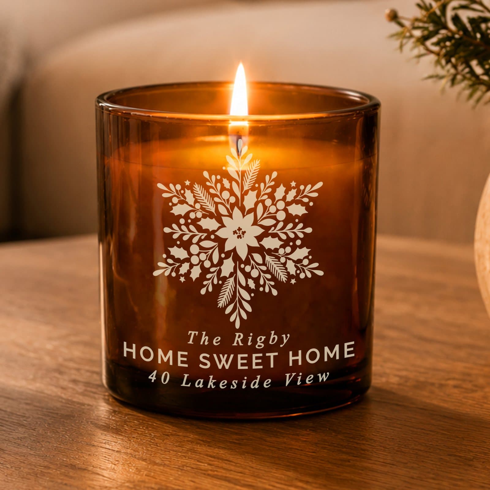 Amber glass candle jar with a snowflake design and personalised text